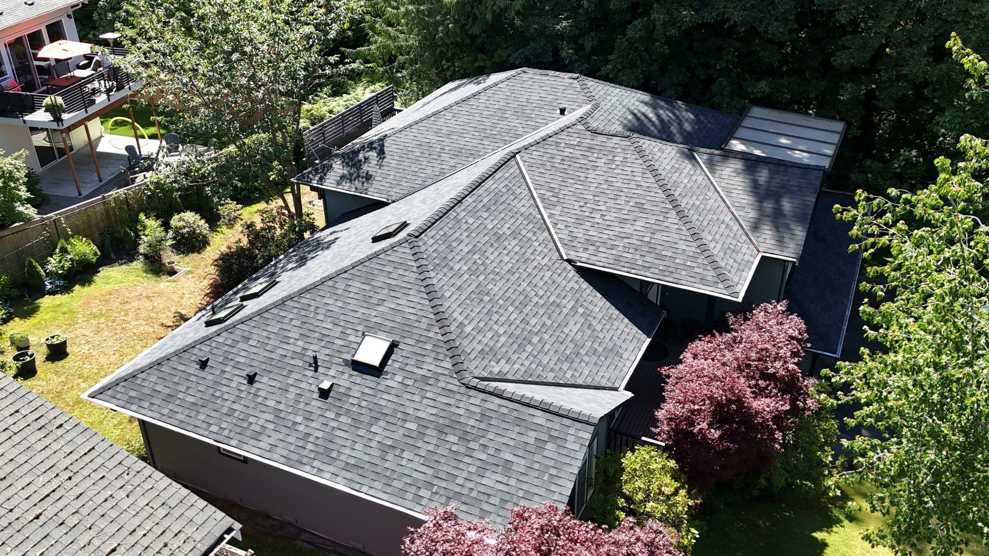 Aerial across the hips of the finished Malarkey Vista Midnight Black asphalt shingle roof, Edmonds, WA