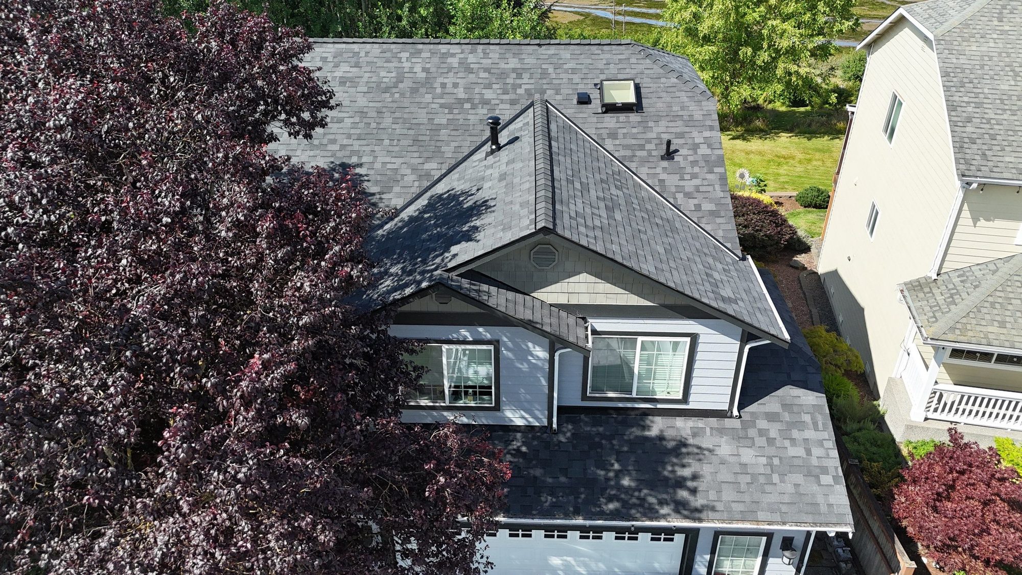 Drone view of the finished Malarkey Midnight Black asphalt shingle roof, Marysville, WA, by Amor Roofing