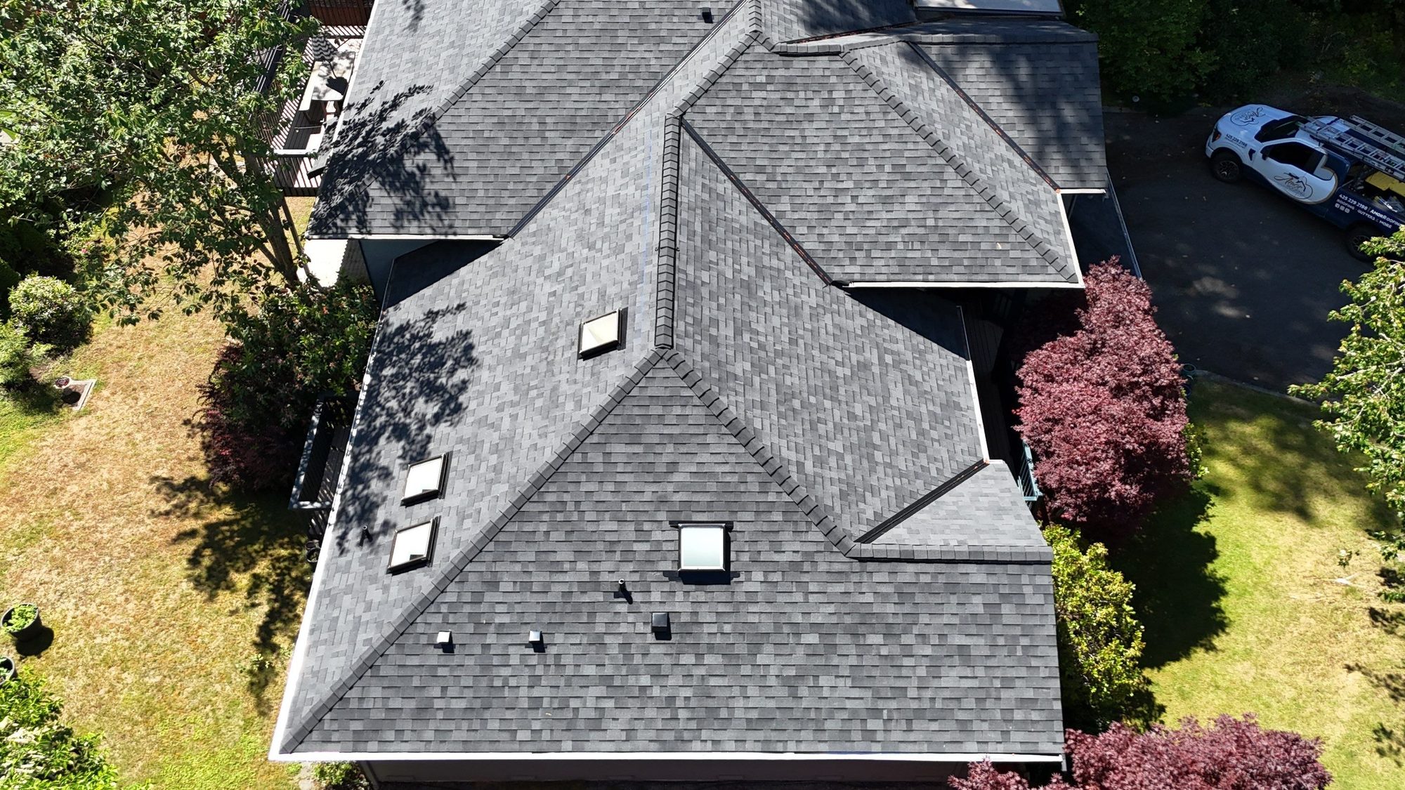 Aerial view of the roof ridges and valleys in Midnight Black asphalt shingles, Edmonds