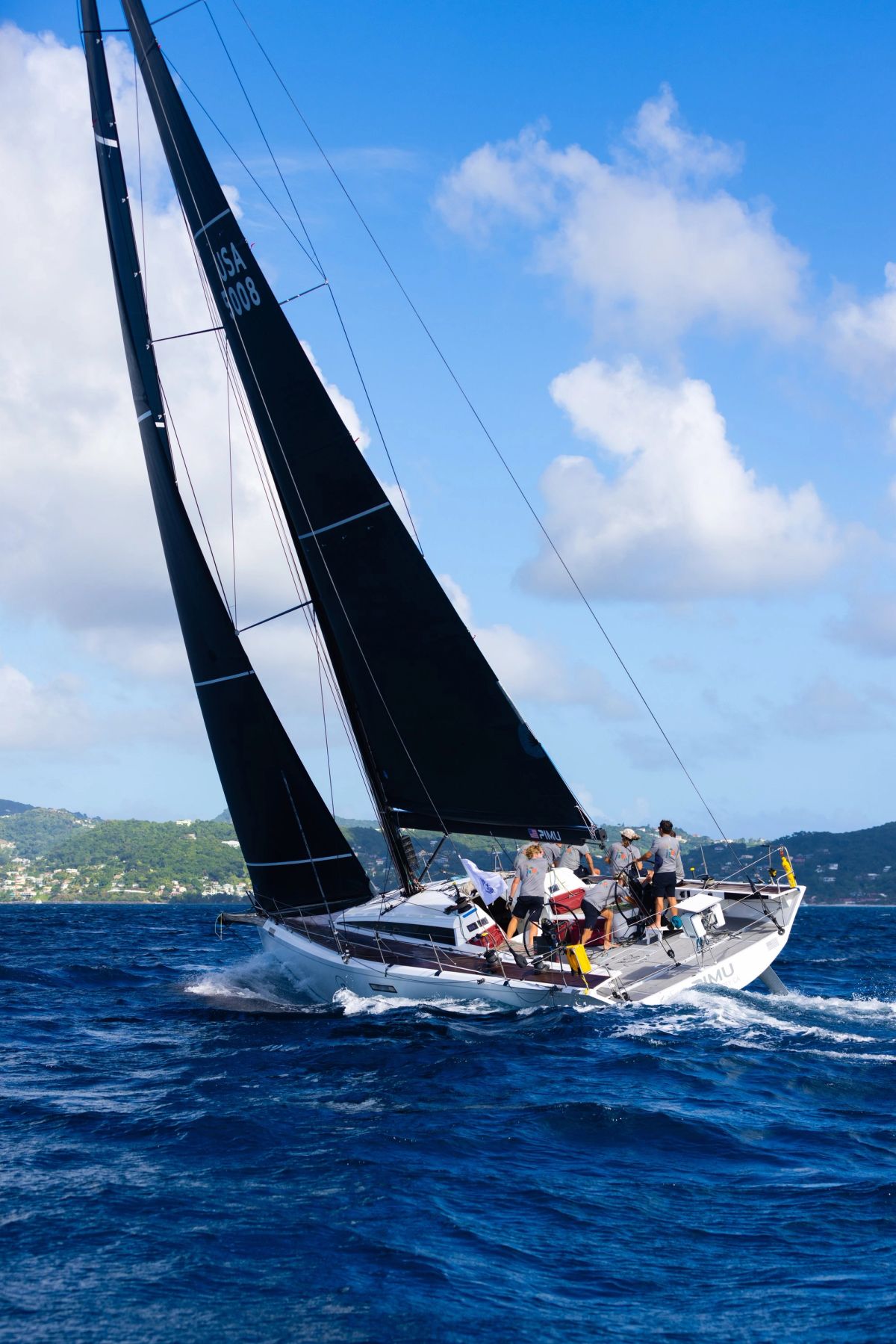 Pimu heeled upwind under a tall sky