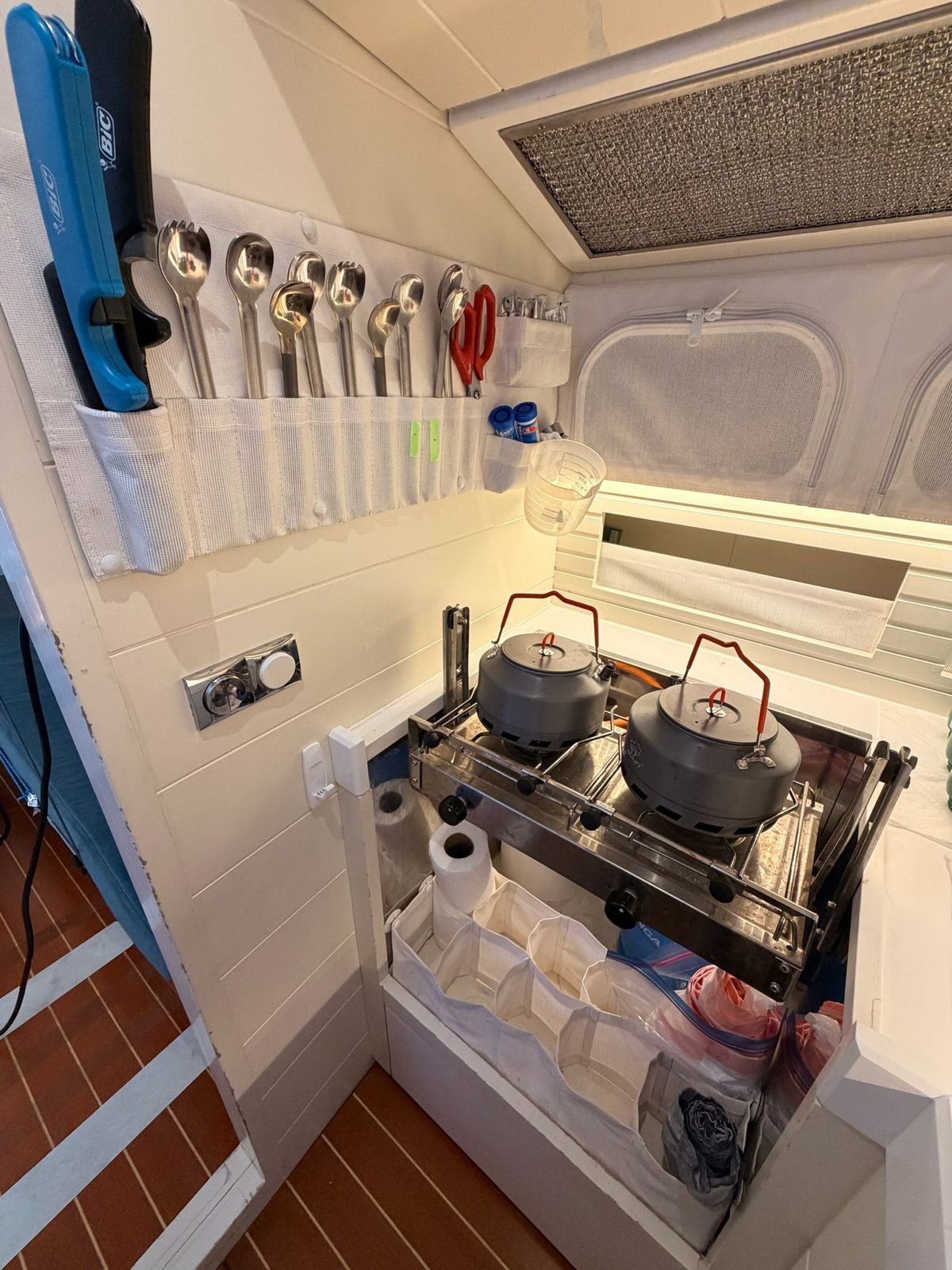 Galley stove and utensil stowage