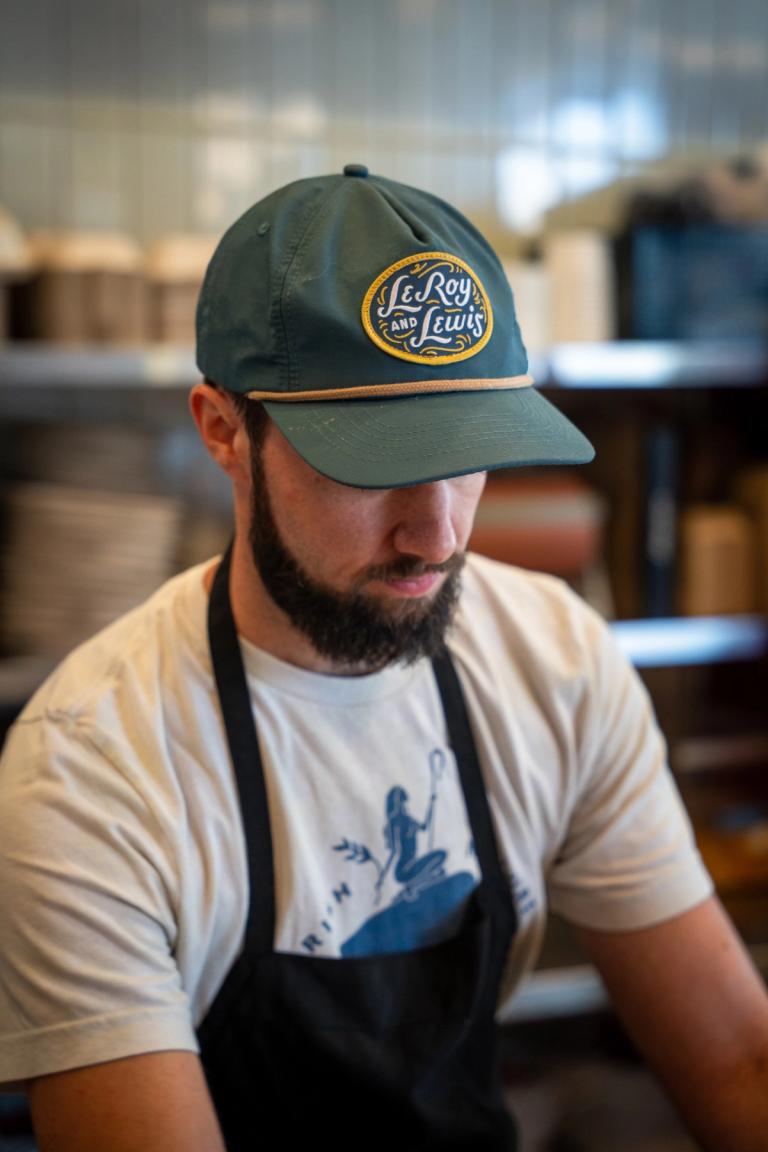Teal rope cap with the oval LeRoy and Lewis patch