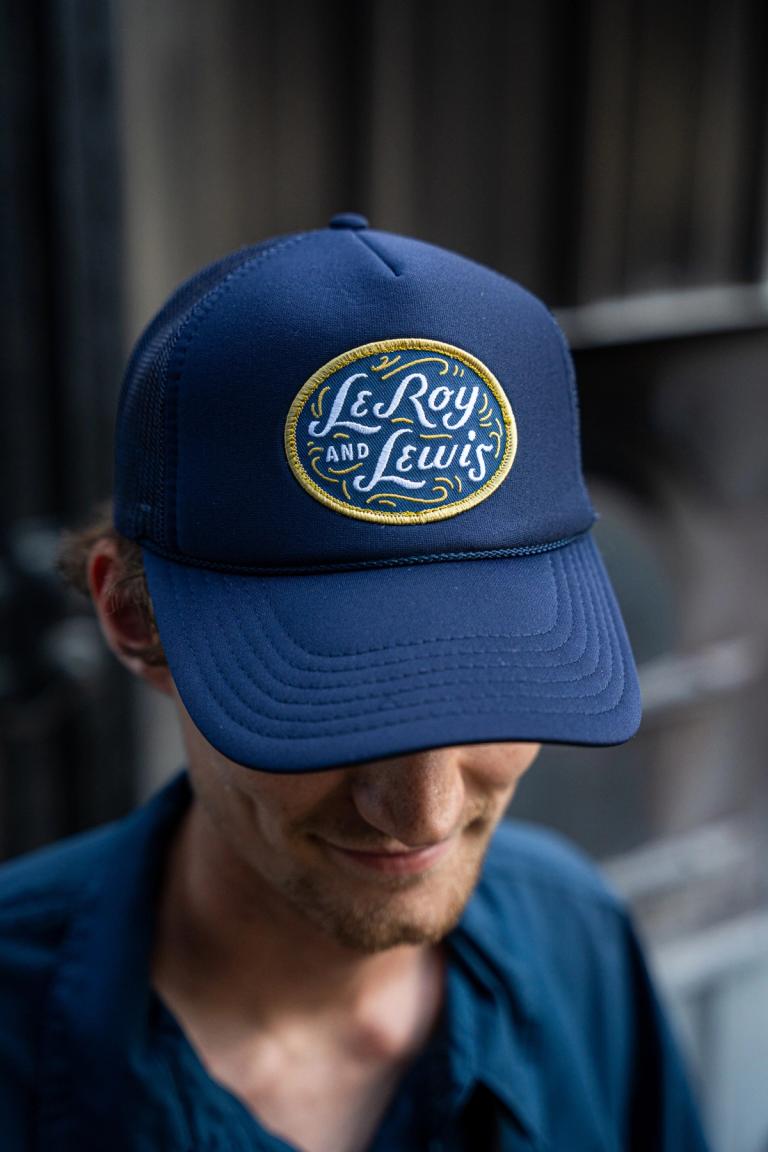 Navy trucker cap with the oval LeRoy and Lewis patch
