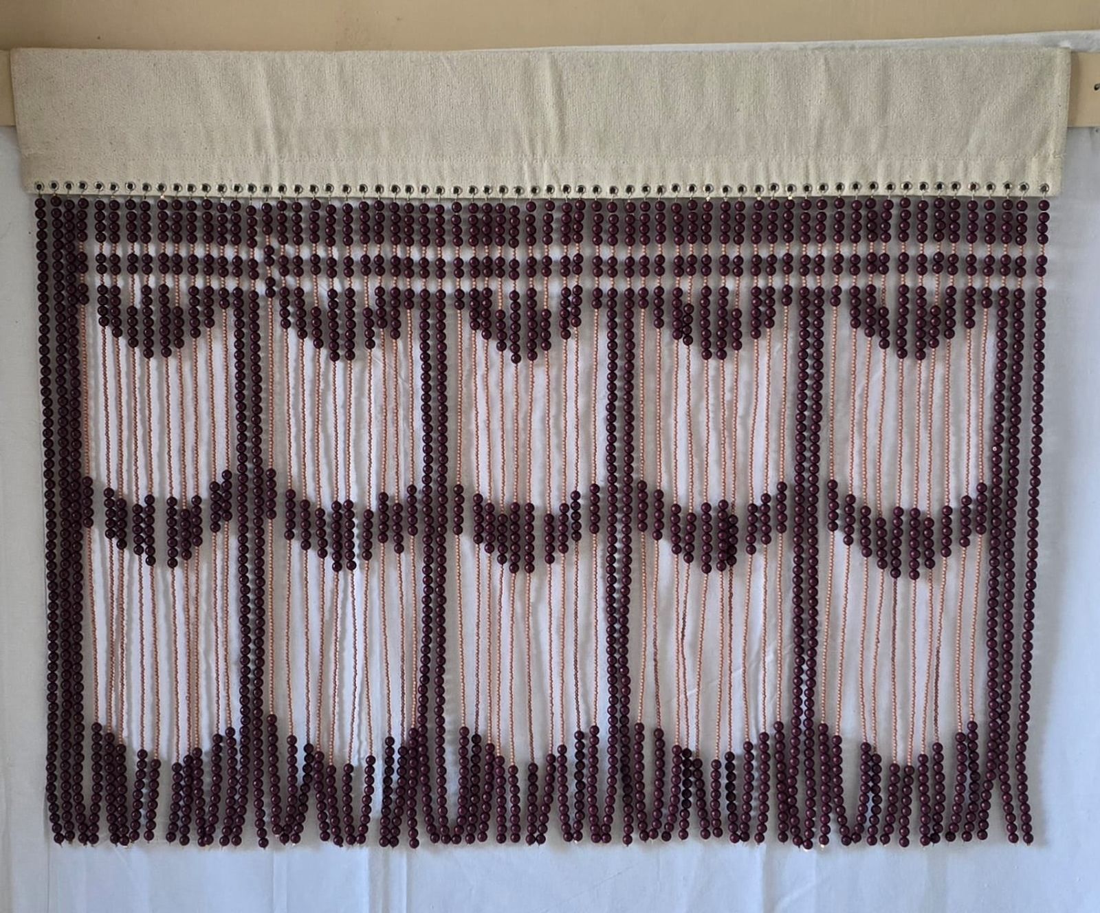 Hand-beaded window valance in plum and cream