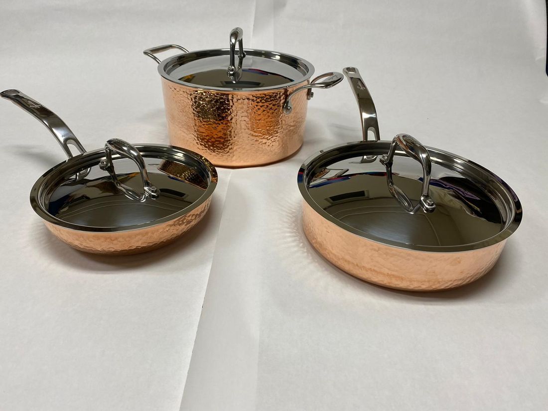 Hammered copper pan set, top view