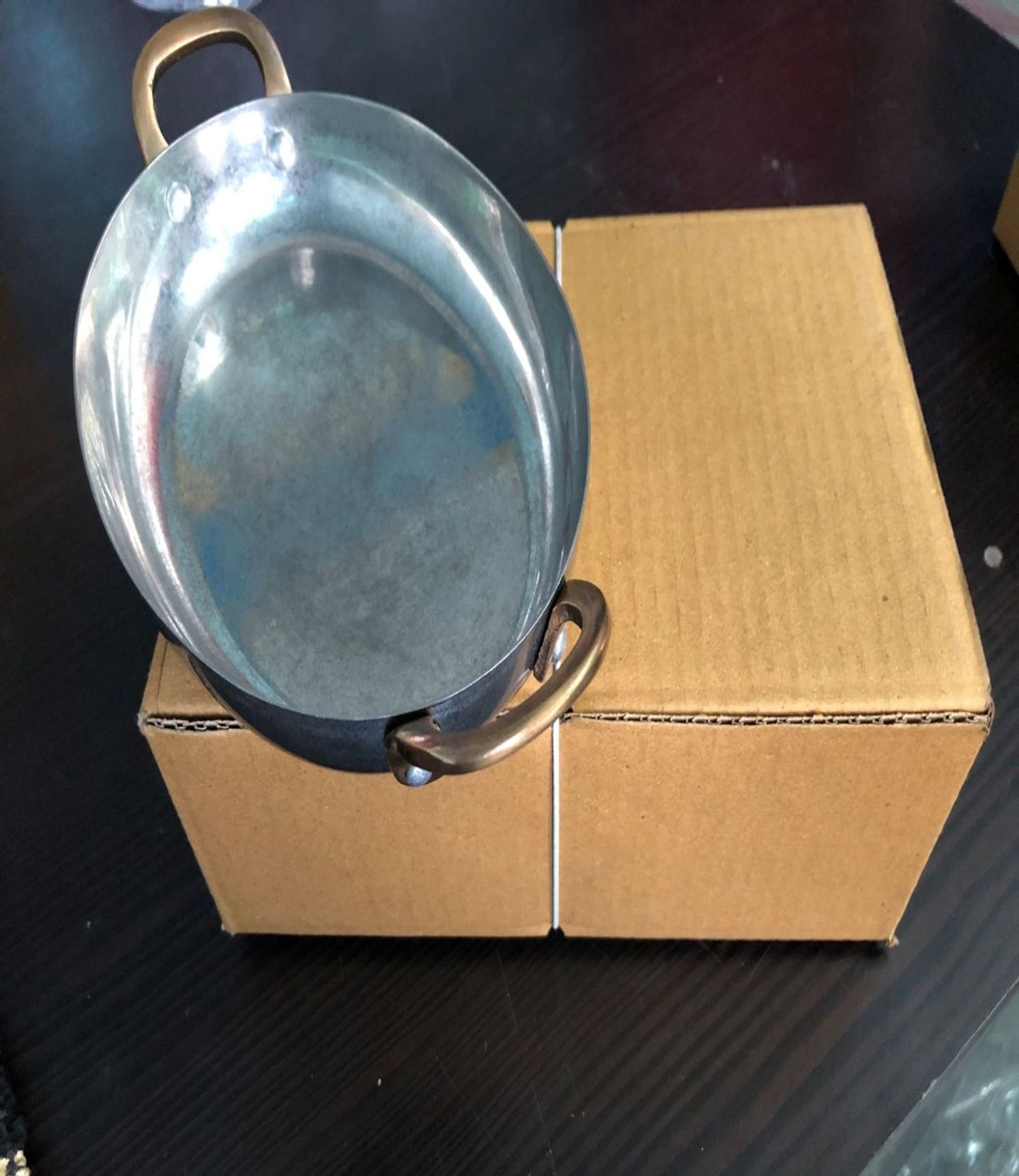 Hammered copper saute pan with a helper handle for tableside service