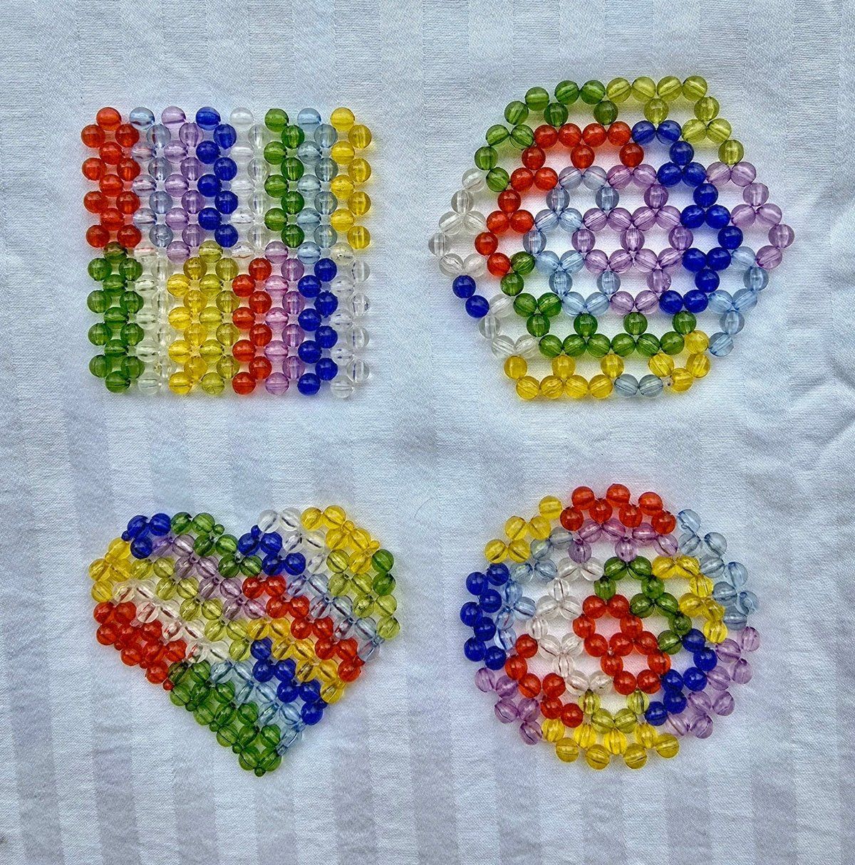 Hand-beaded glass coasters in assorted patterns