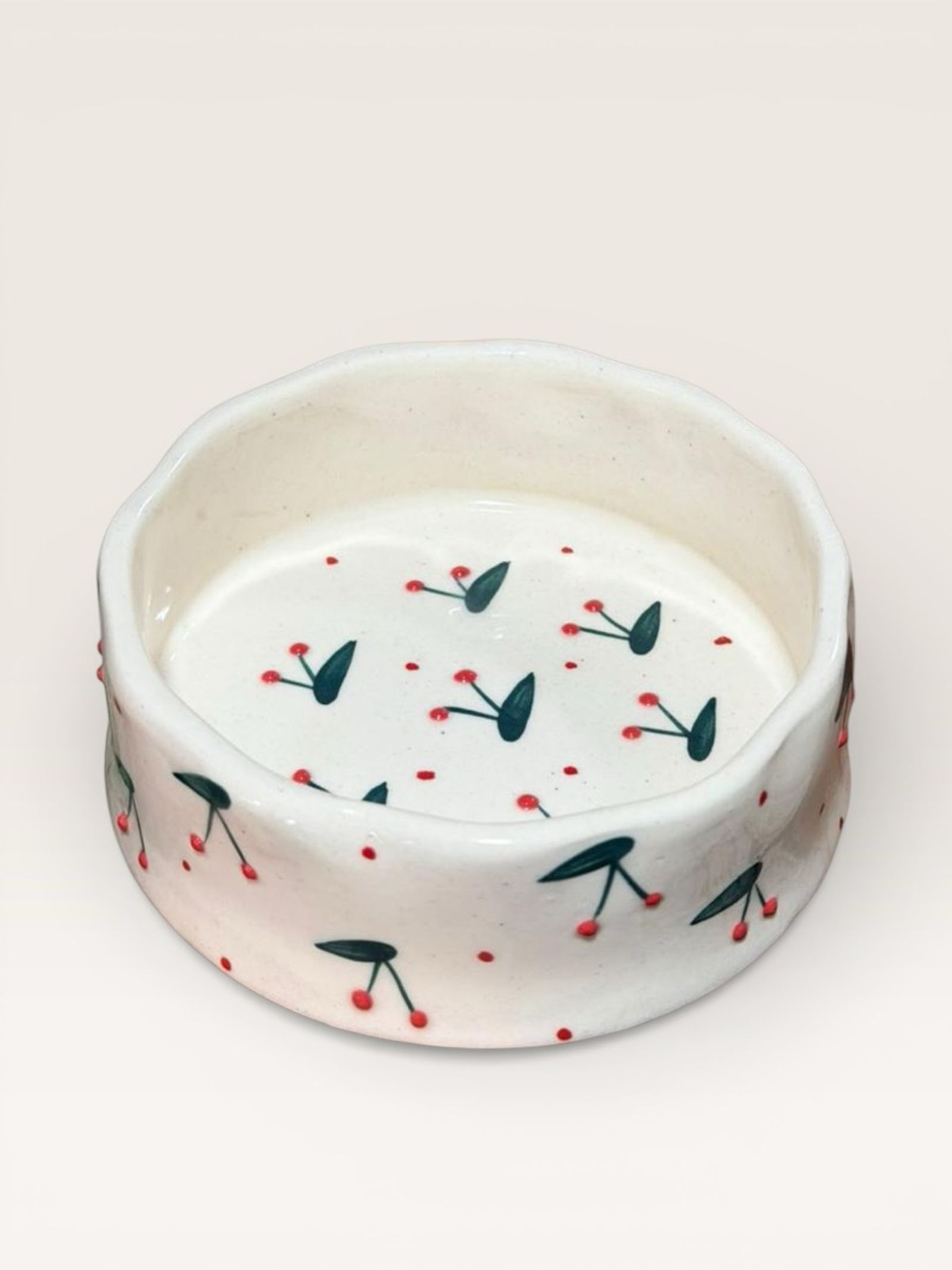 Hand-painted stoneware bowl with a cherry pattern