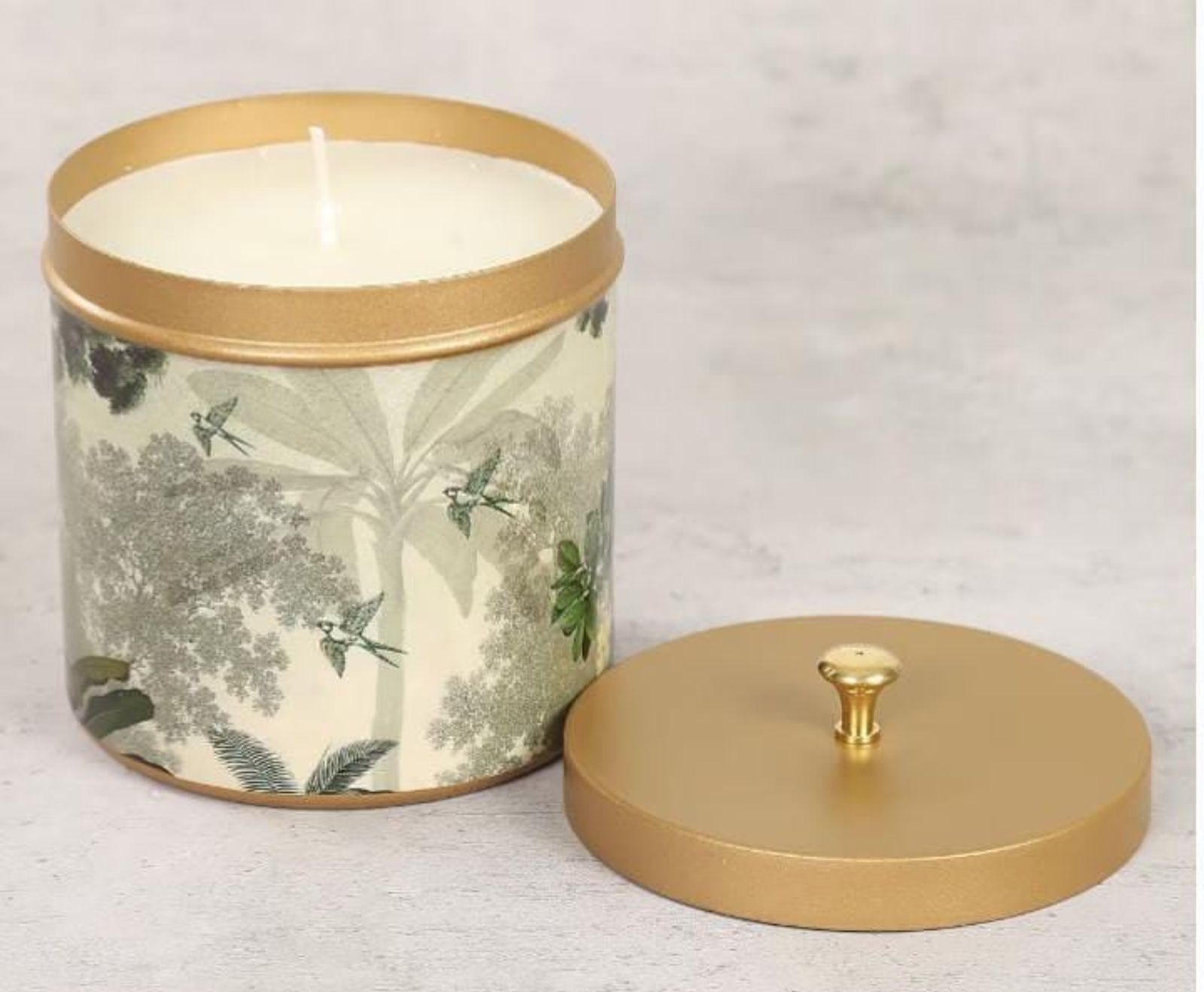 Printed ceramic candle jar with a brushed gold lid
