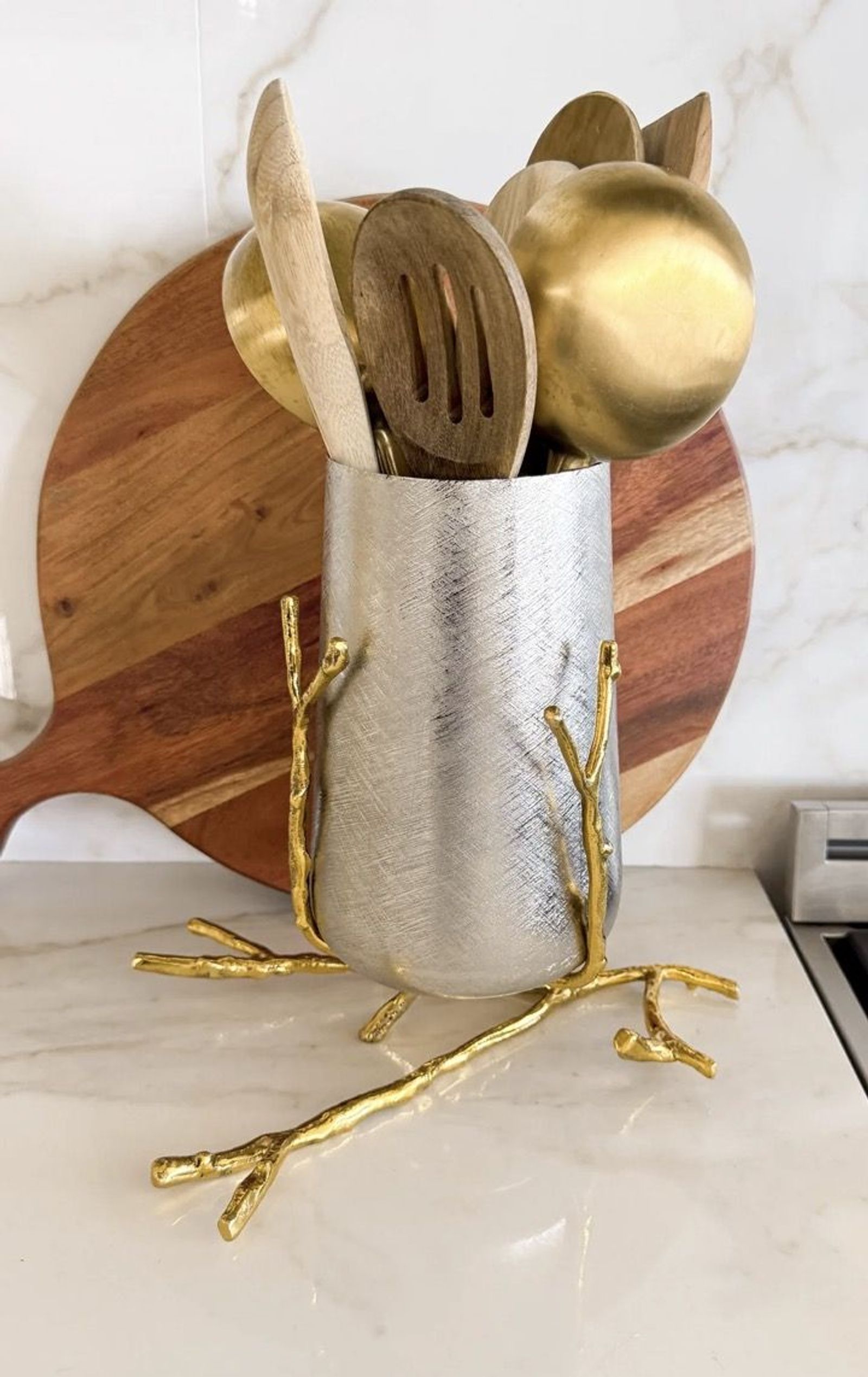 Marble utensil holder with brass kitchen tools