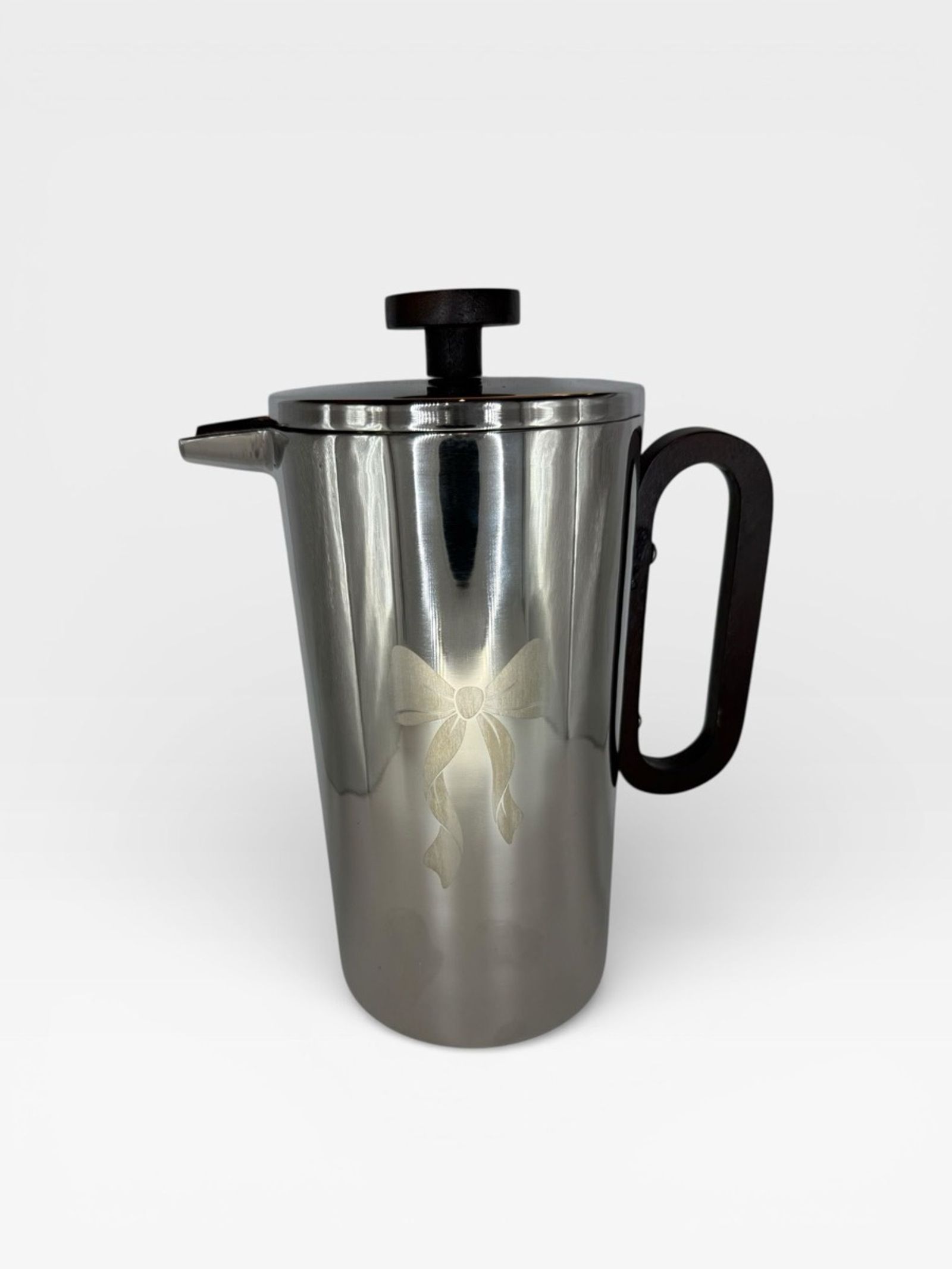 Polished double-wall stainless French press with etched bow motif and wood handle