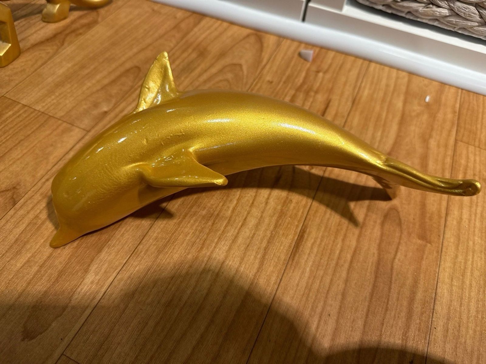 Gold resin dolphin statuette