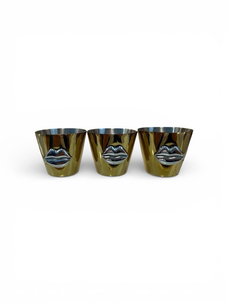Trio of gold-PVD Icon shot glasses with sculpted silver lips