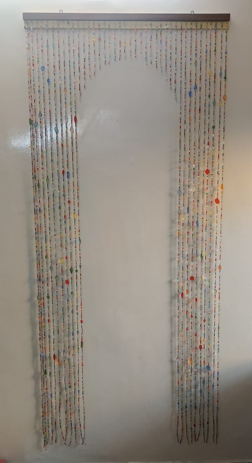 Hand-strung multicoloured beaded doorway curtain