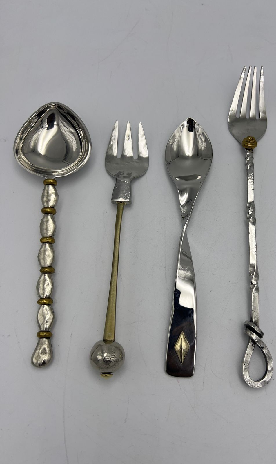 Mixed-metal flatware with hammered, beaded and inlaid handles