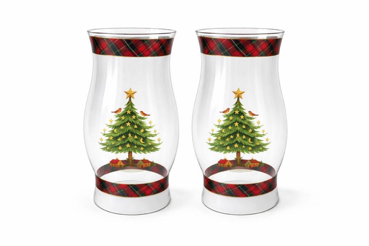 Pair of clear glass hurricanes with a printed Christmas-tree and tartan motif