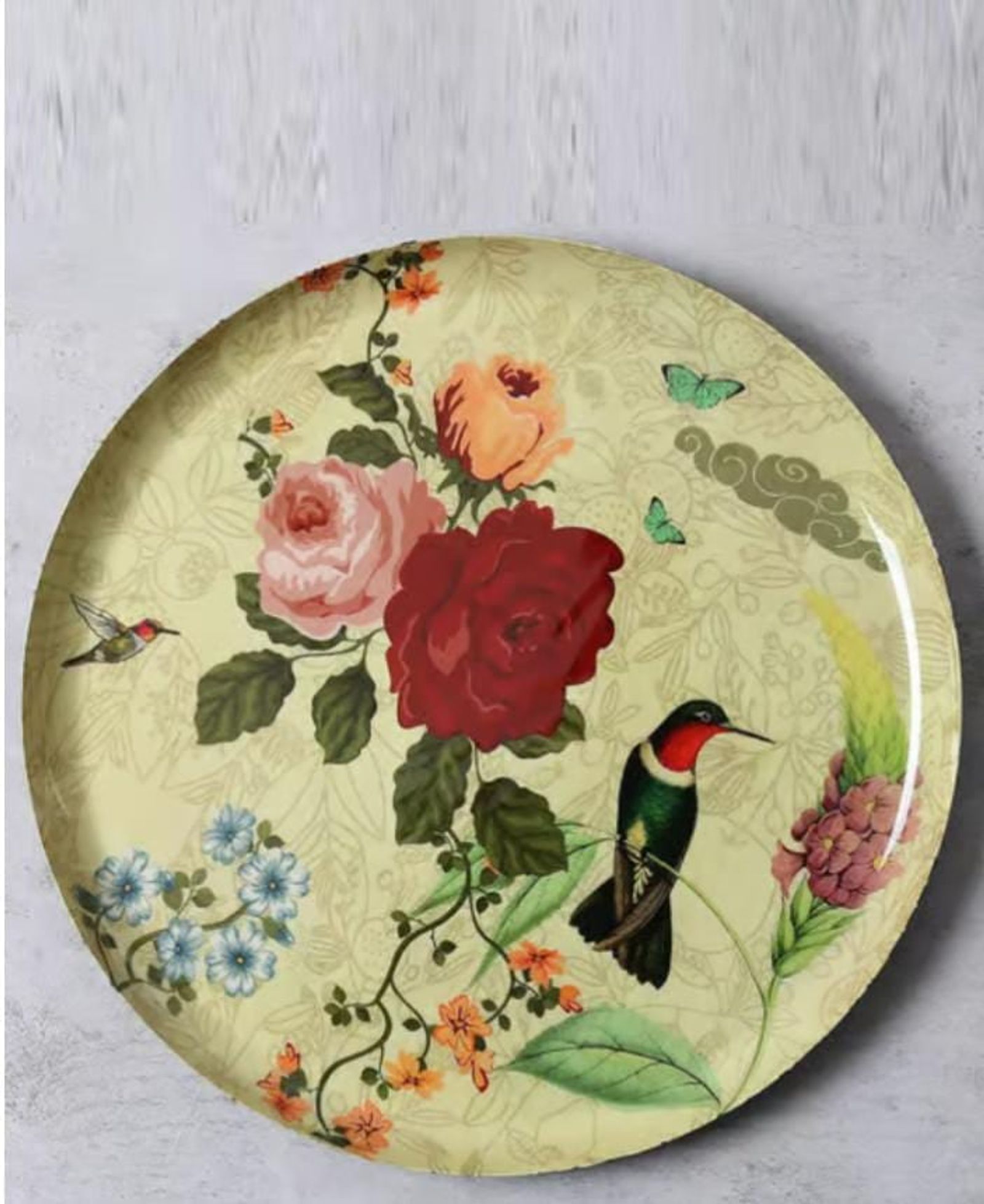 Decorative plate with a printed hummingbird and rose pattern