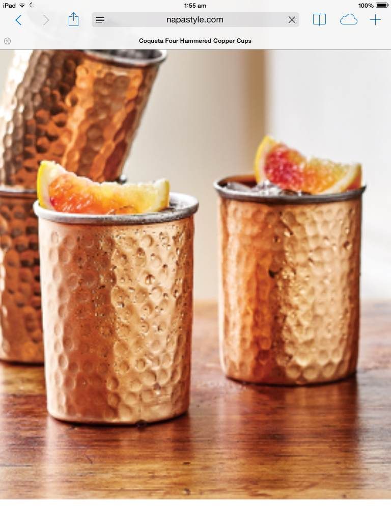Hammered copper tumblers with grapefruit cocktails