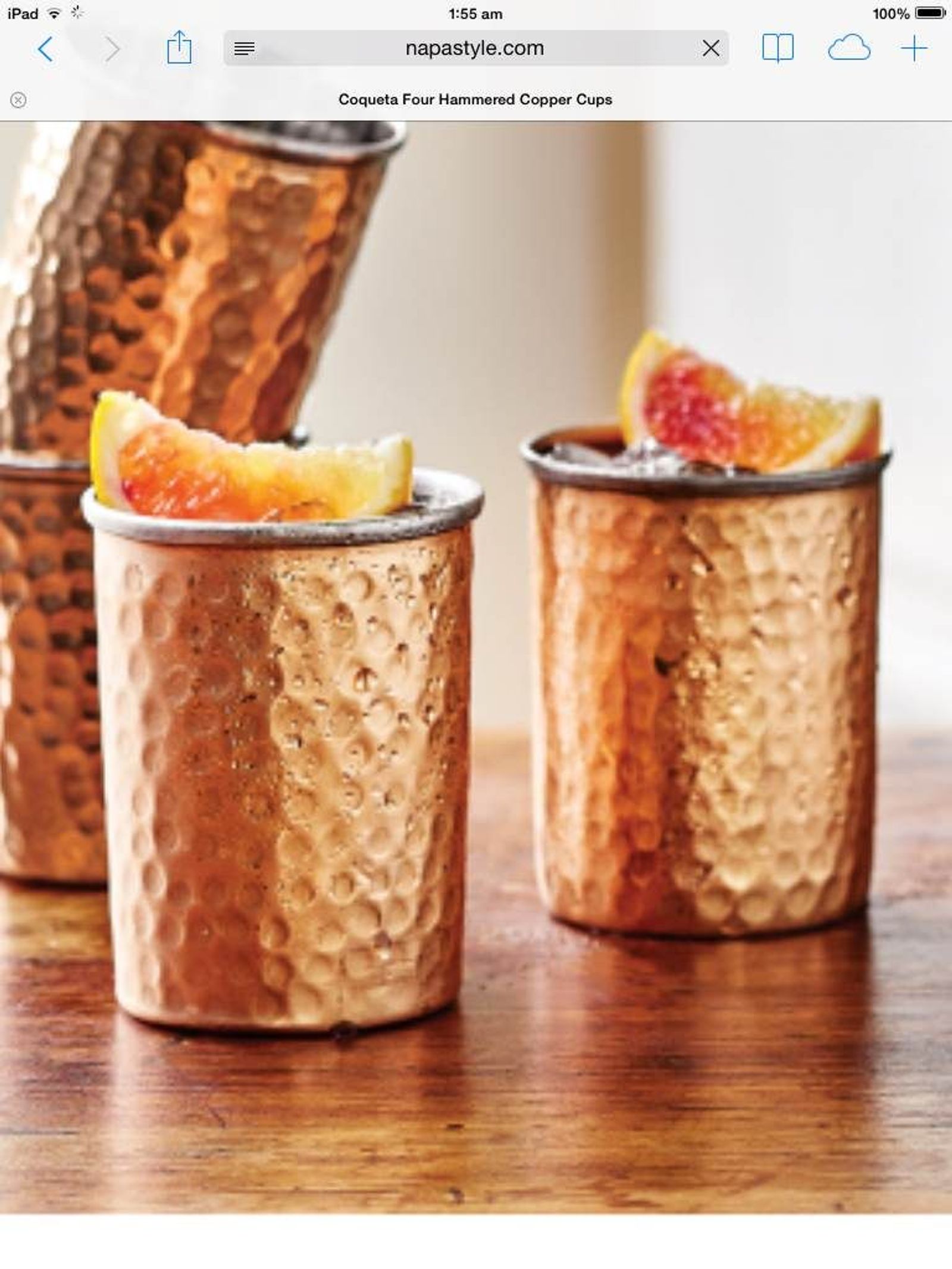 Hammered copper tumblers with grapefruit cocktails