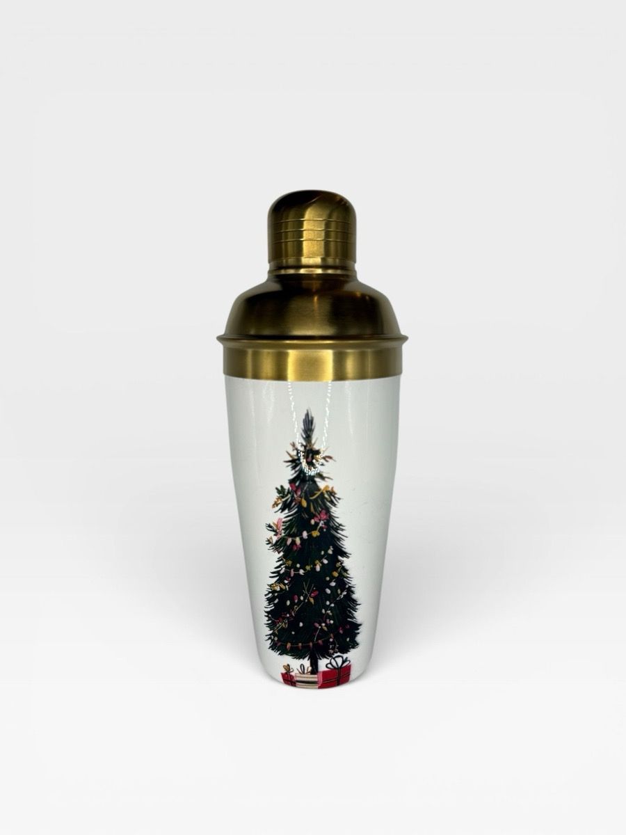 Gold-top cocktail shaker with a printed winter-tree motif