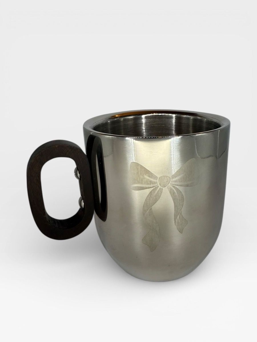 Polished double-wall stainless coffee mug with etched bow and wood handle
