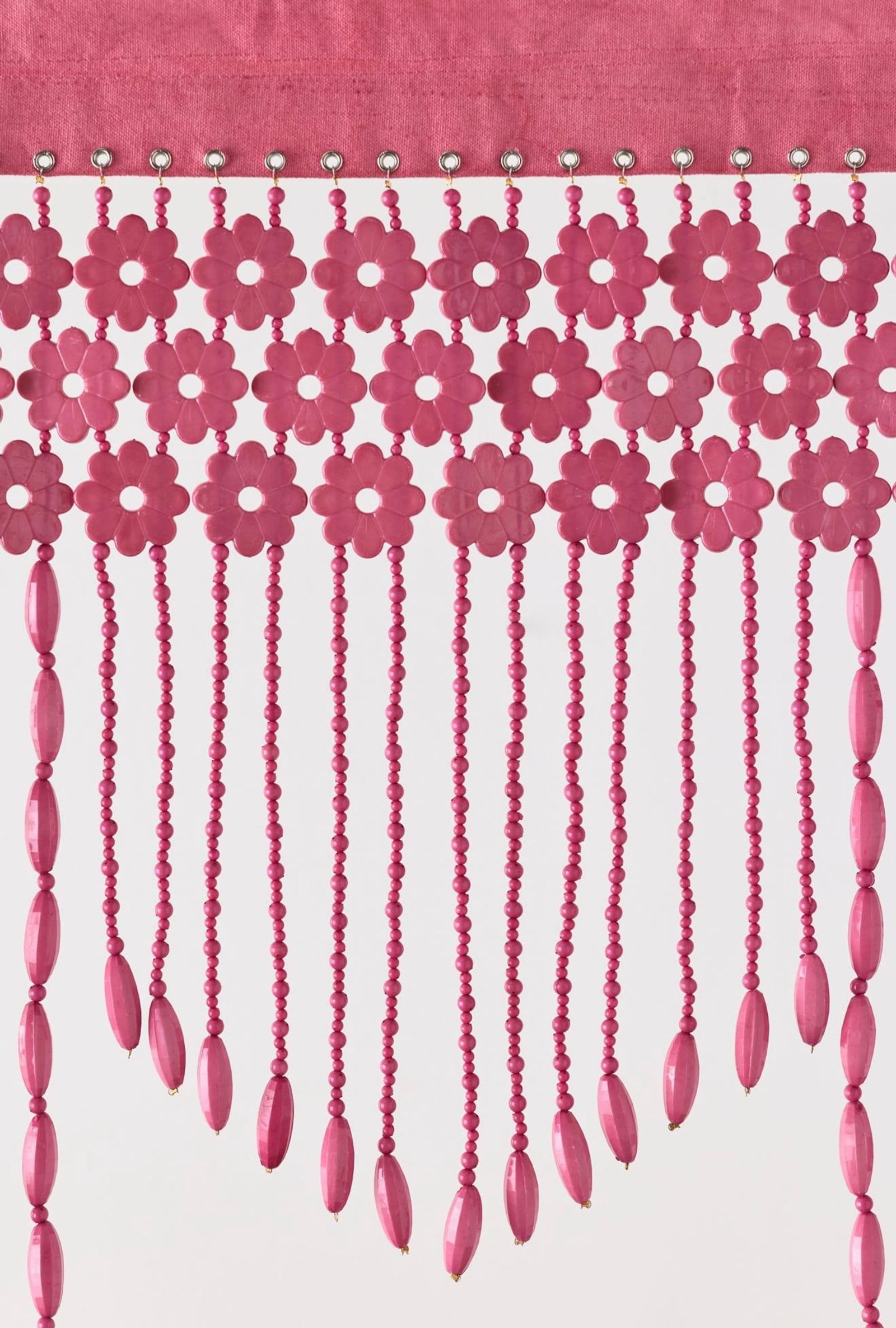 Pink hand-beaded valance with a flower motif