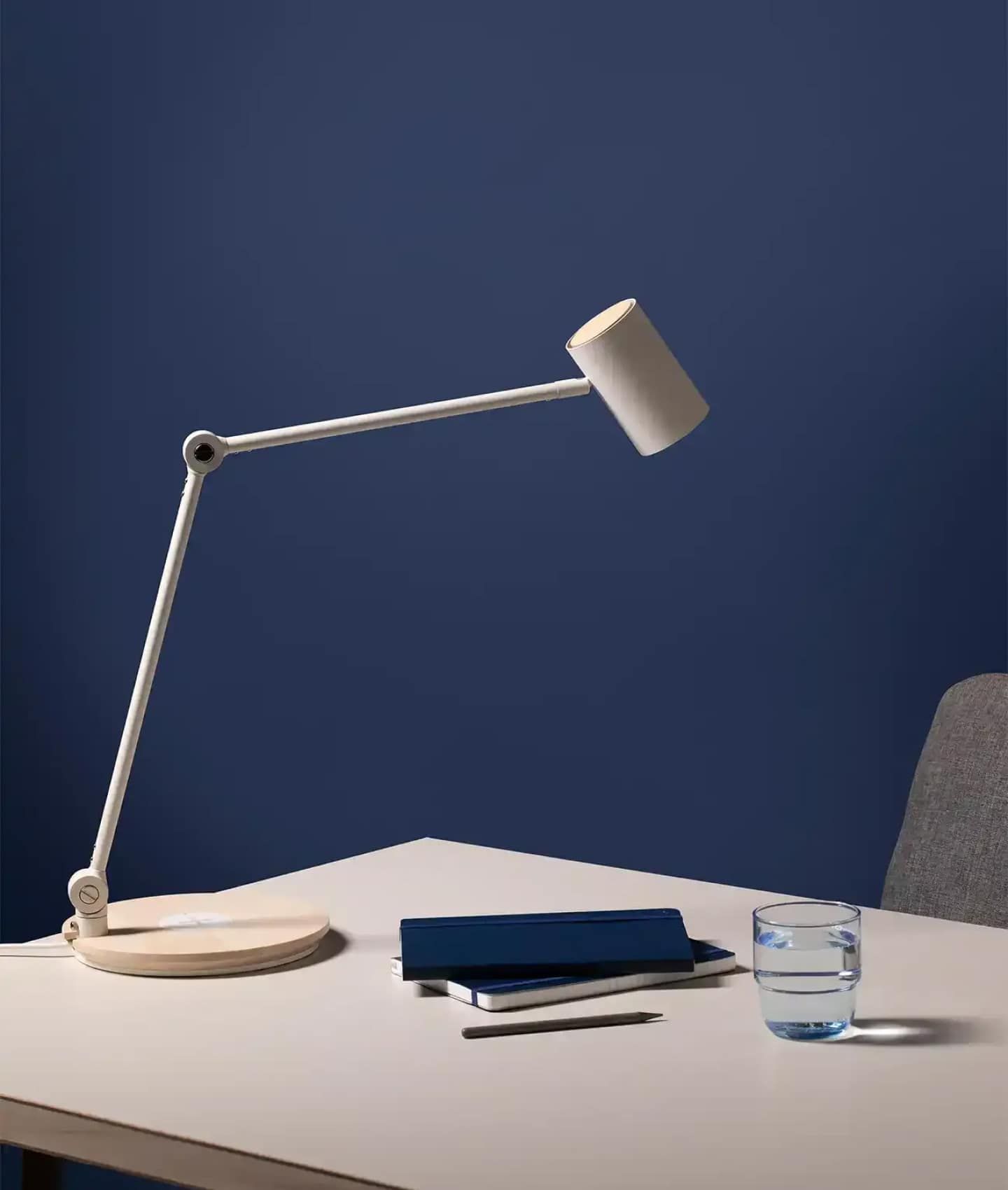 notebook on desk with lamp