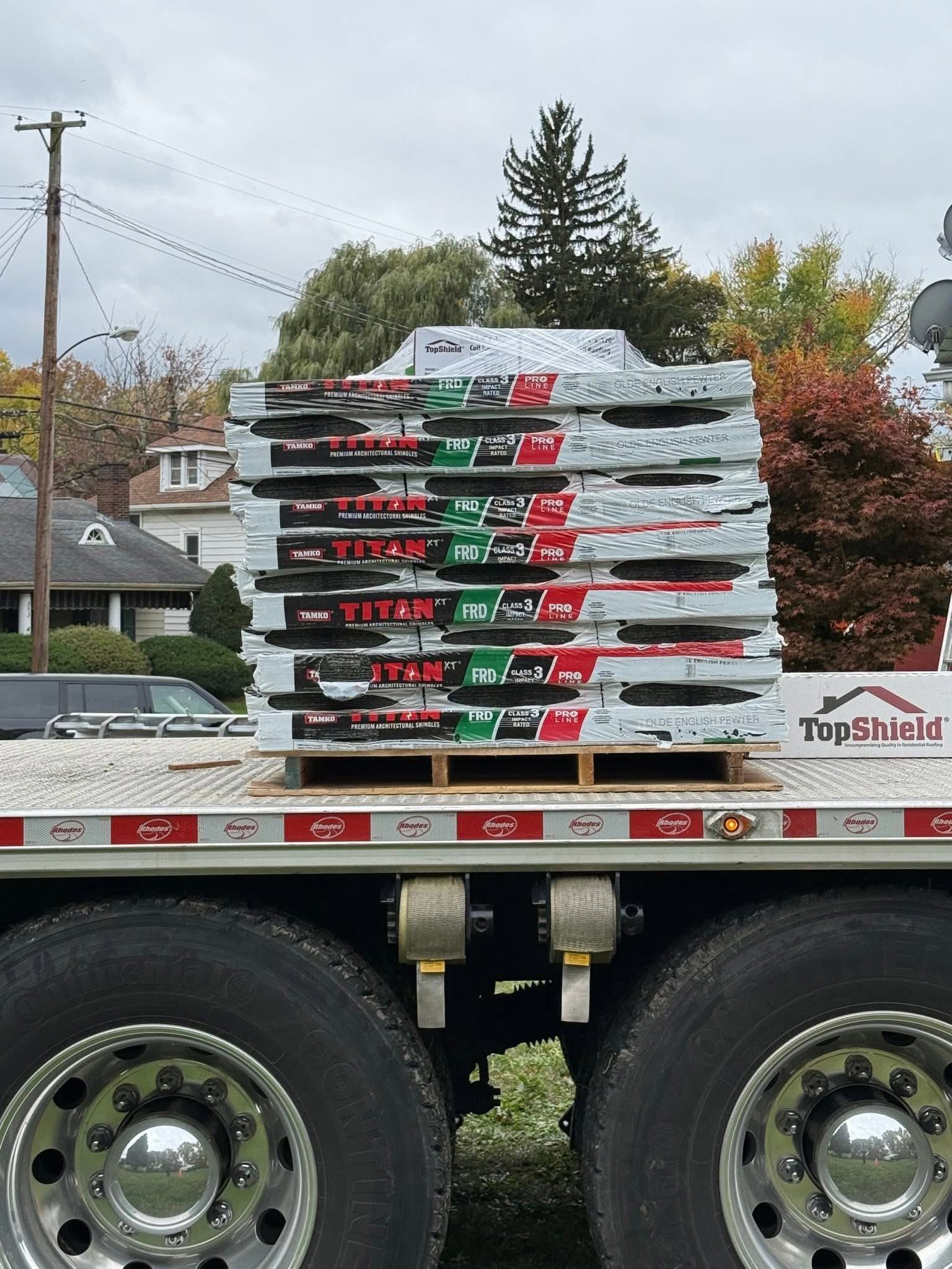 Pallets of new shingles on a delivery truck