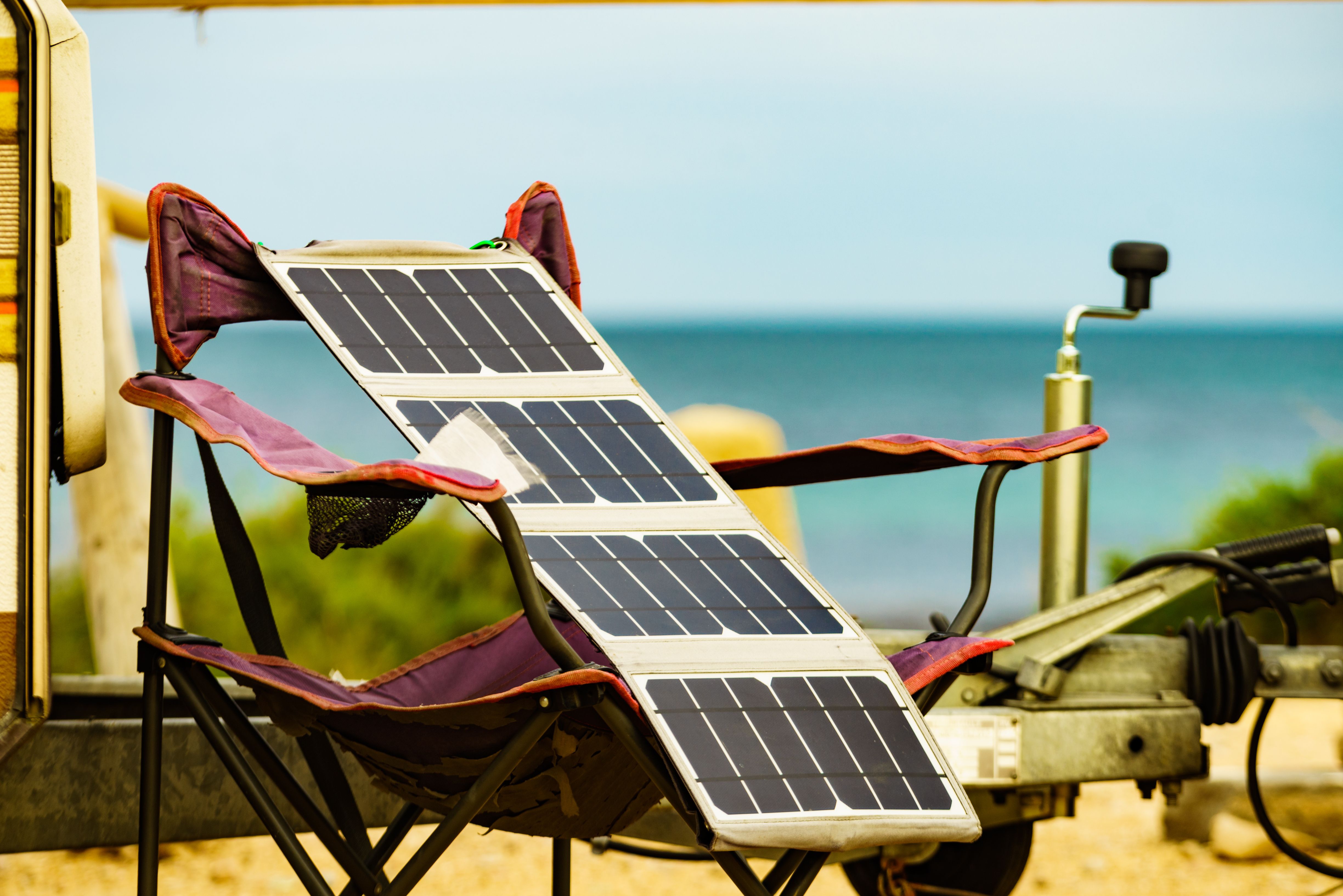 Portable solar panel laid out on a camp chair