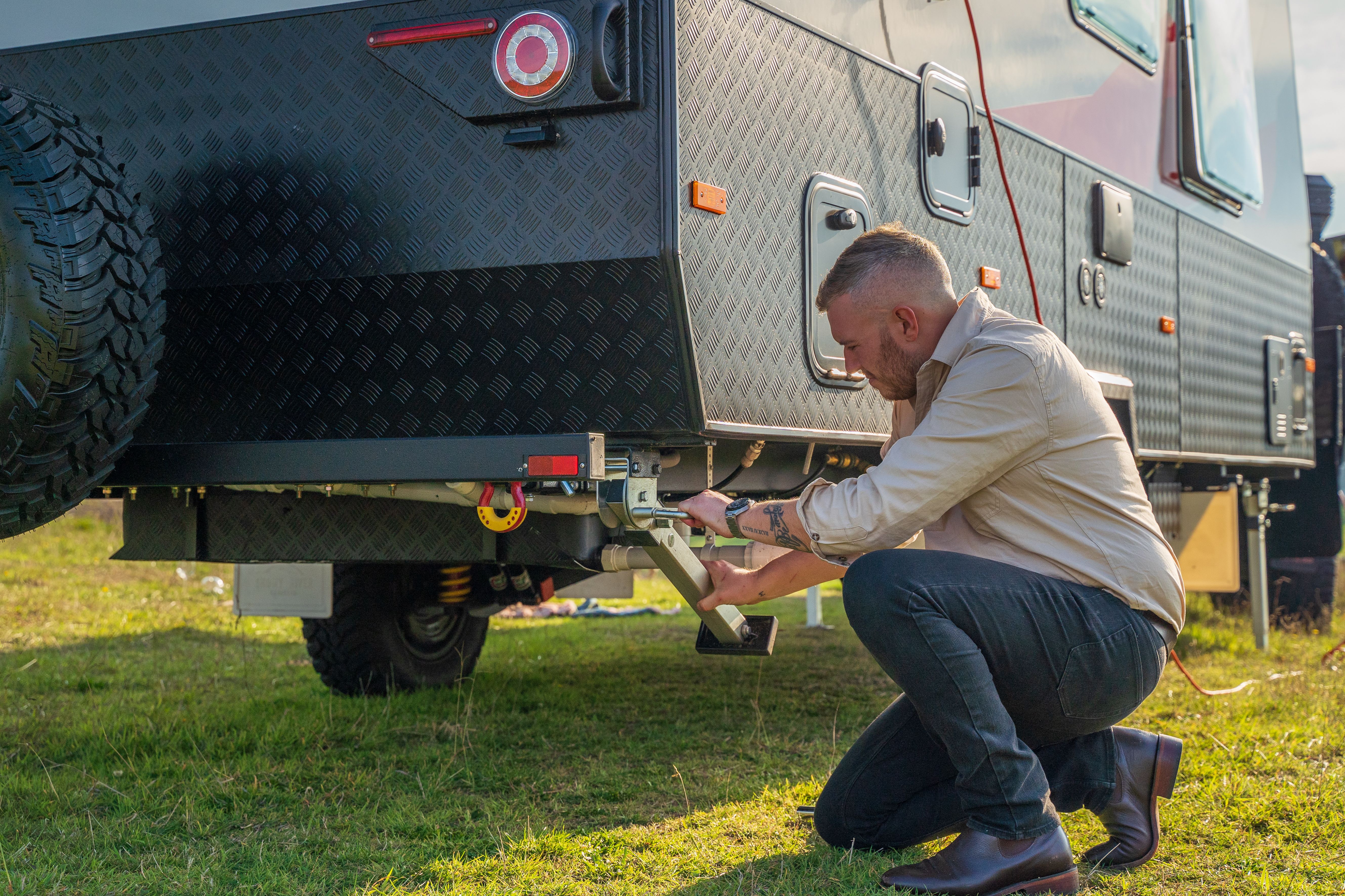 A man checking his caravan