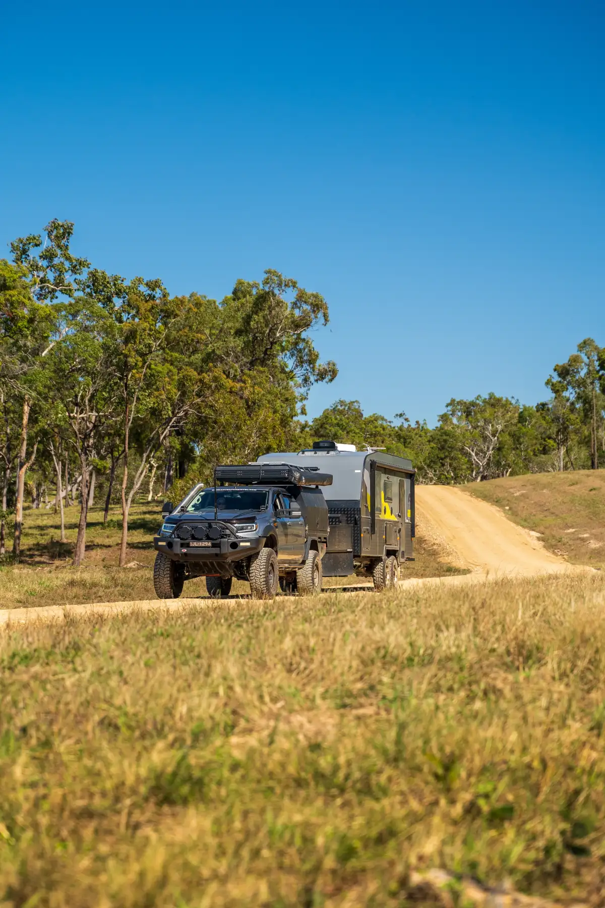 4x4 towing caravan through the bush