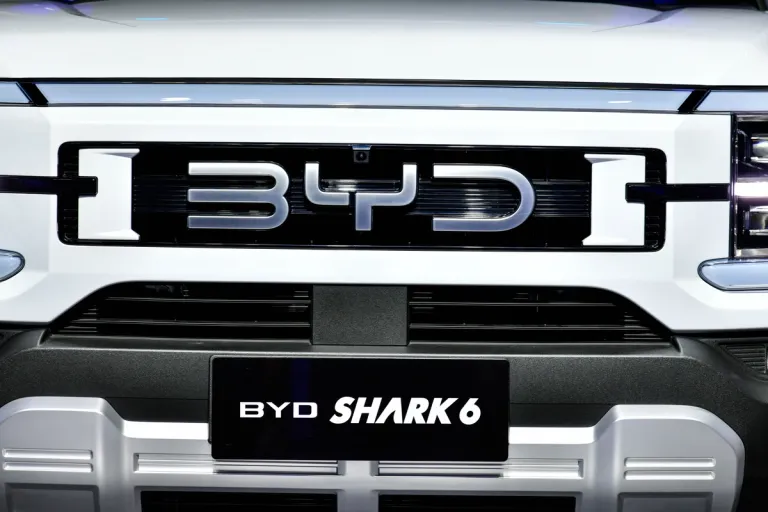 Close-up of the grille of a white BYD Shark 6