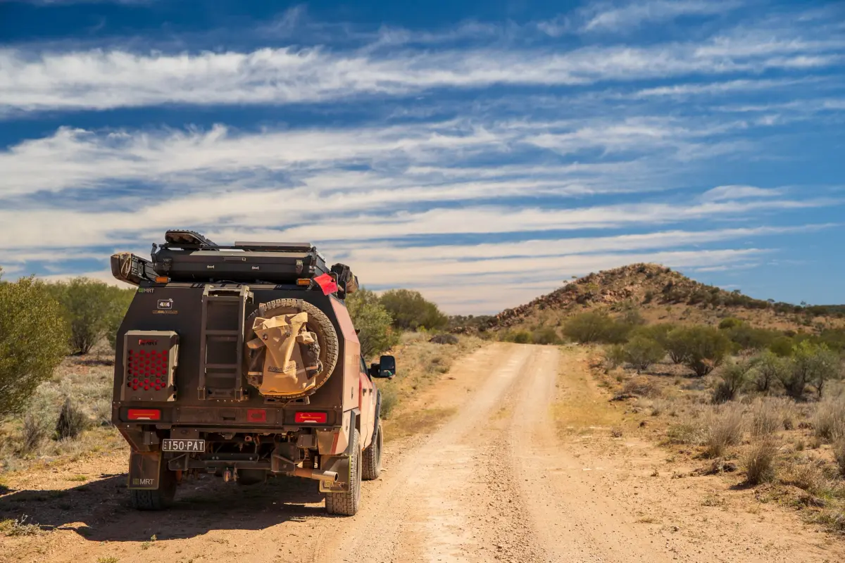 4x4 vehicle on a dirt road in the outback