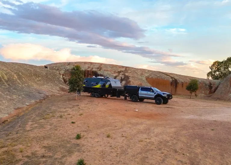 4x4 and caravan in a desert setting