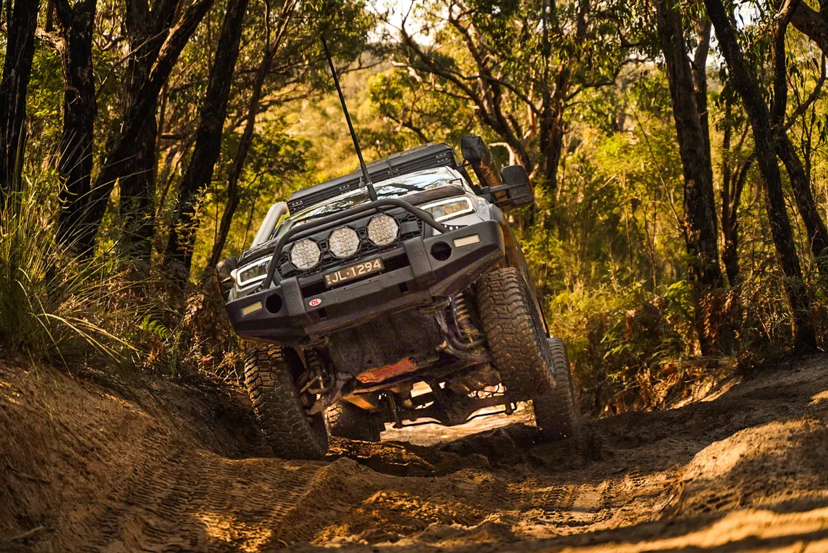 4WD Ford Ranger driving through forest track