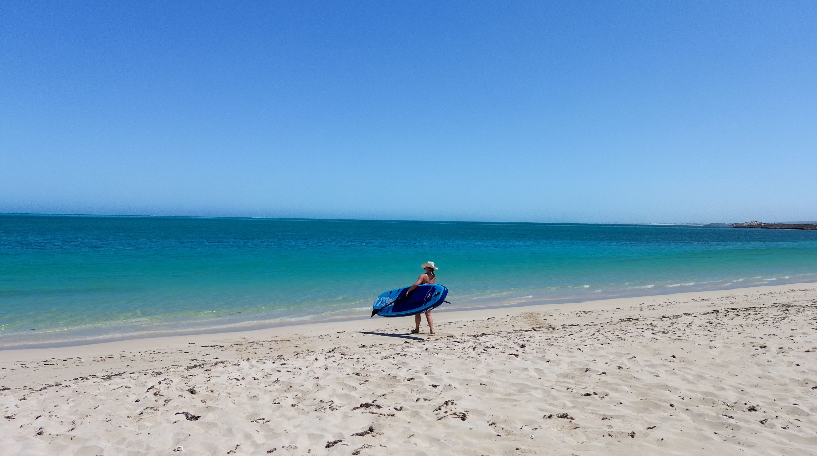 on the beach with a SUP