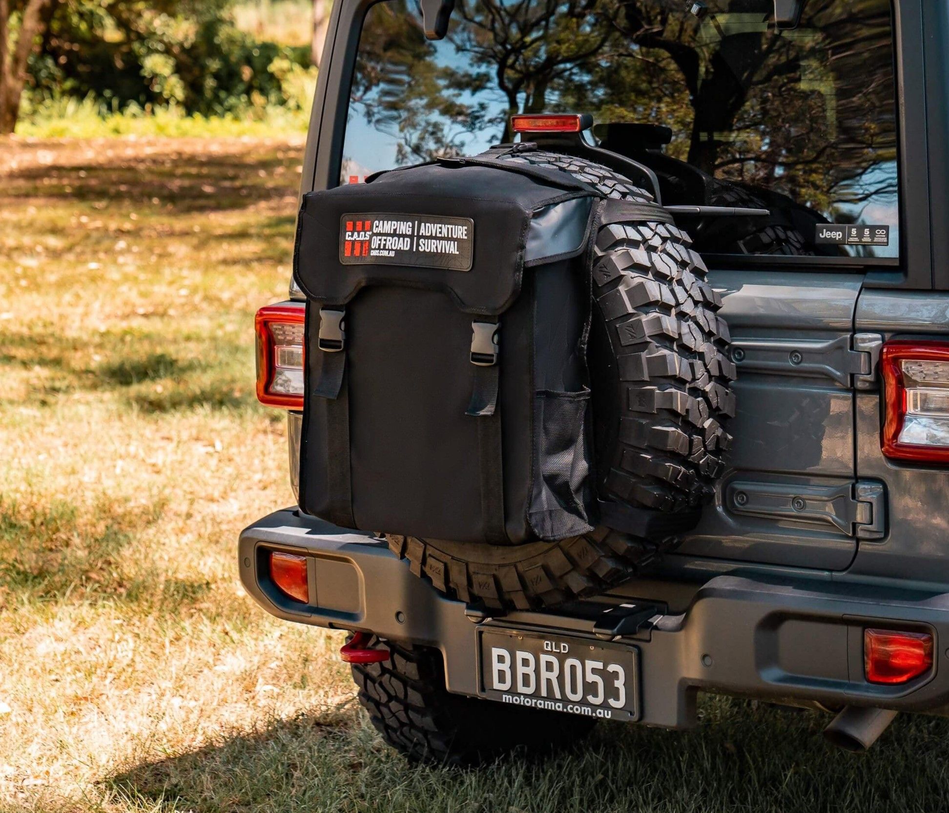 dirty gear bag mounted on a 4X4's spare tyre