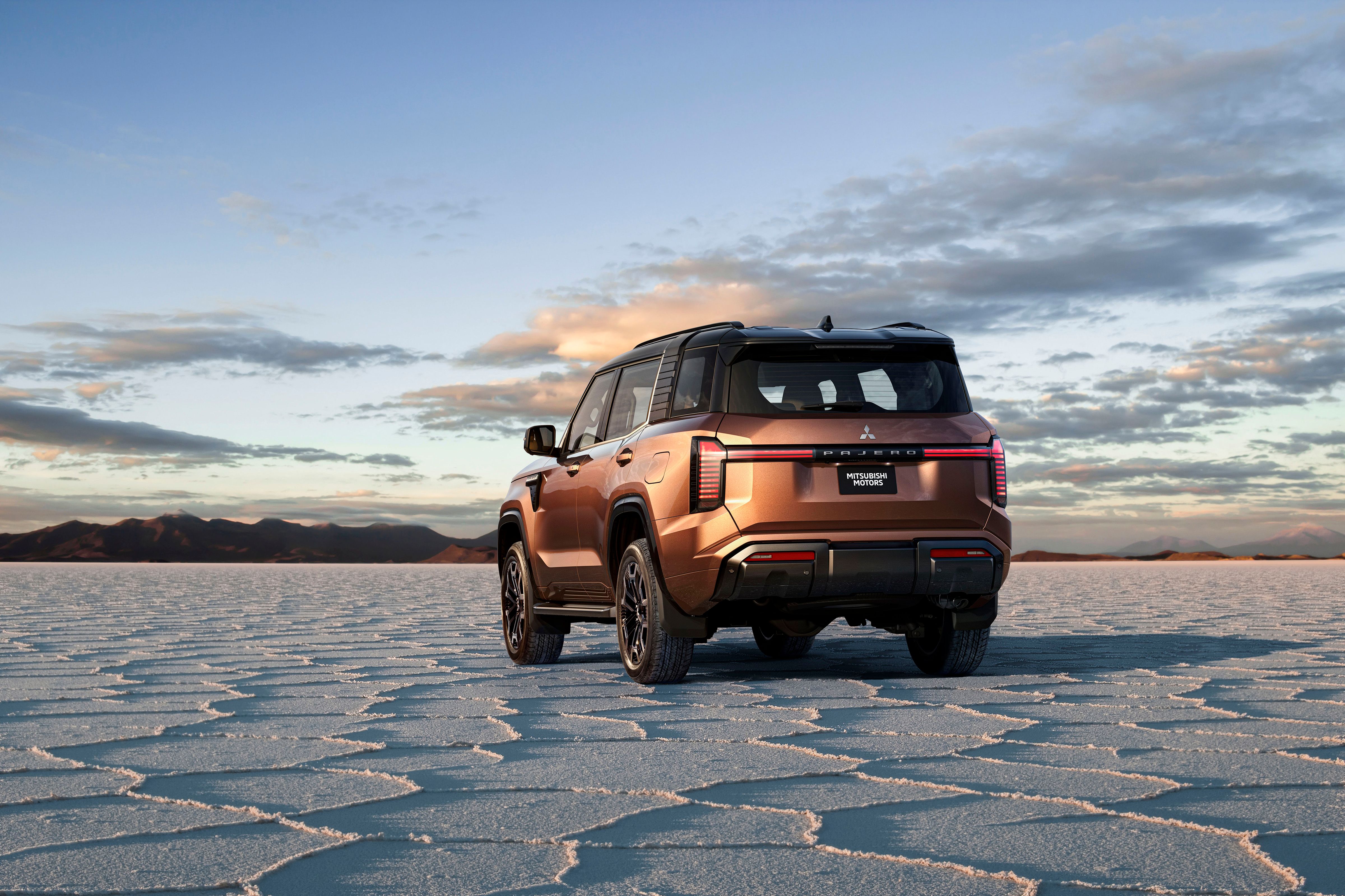 A copper Mitsubishi Pajero on a salt flat