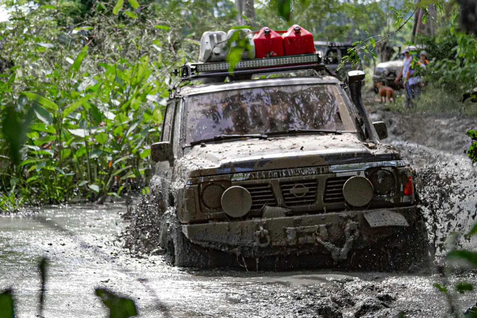 nissan patrol 4x4 driving through mud