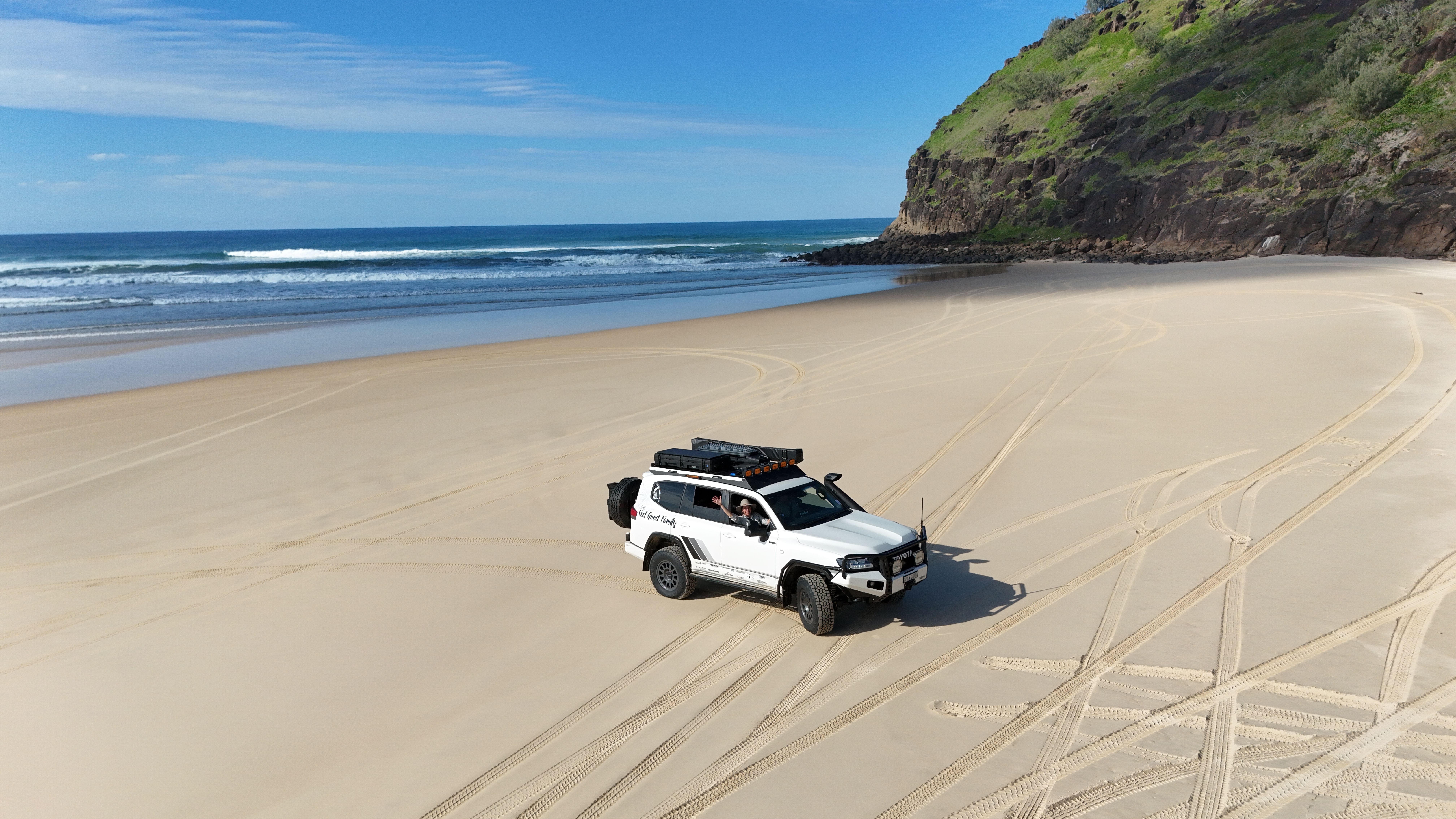 A 4X4 one the beach at K'Gari, Queensland