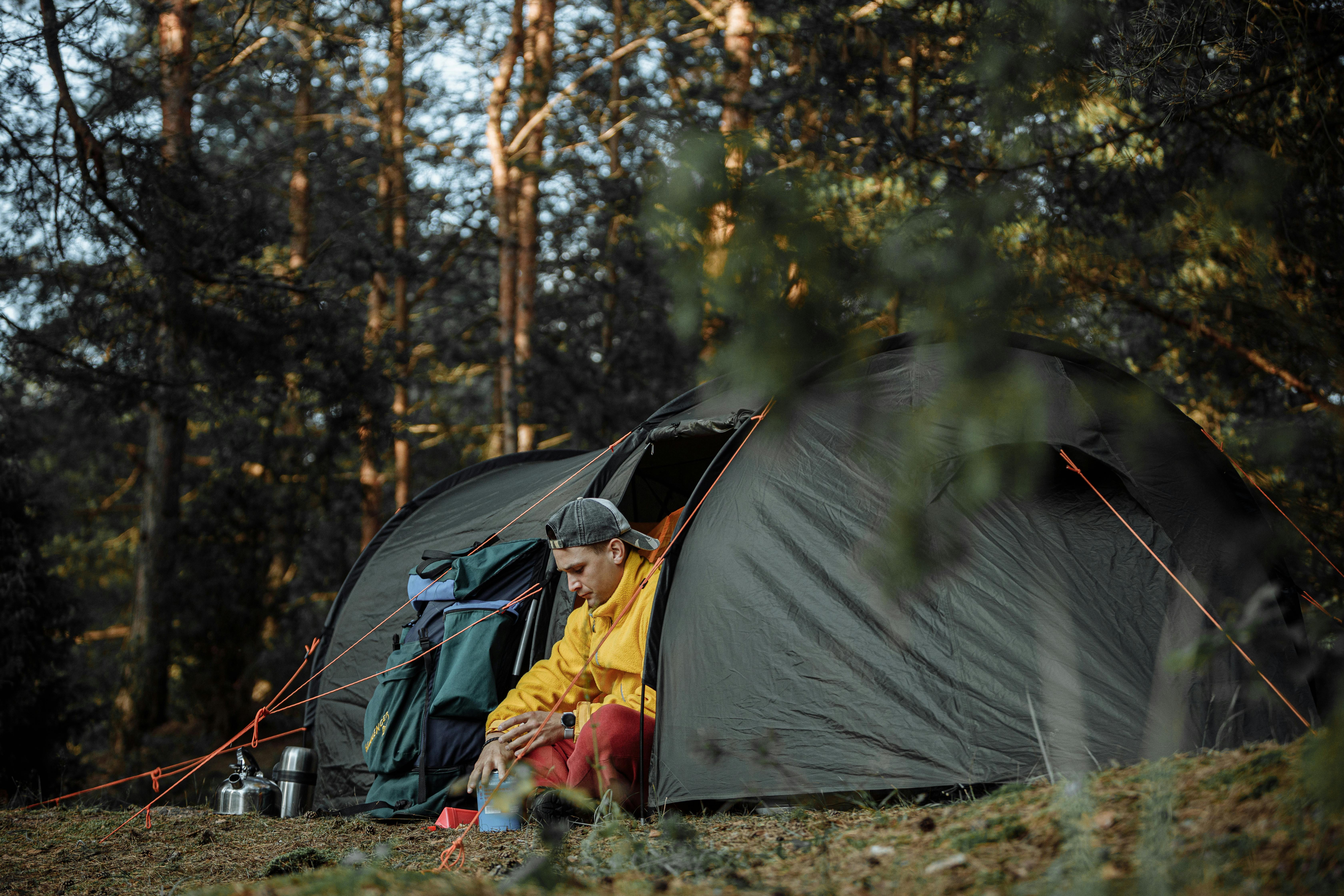 man camping in a swag