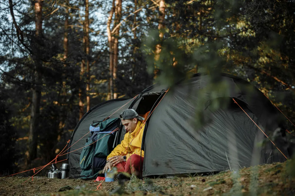 man camping in a swag