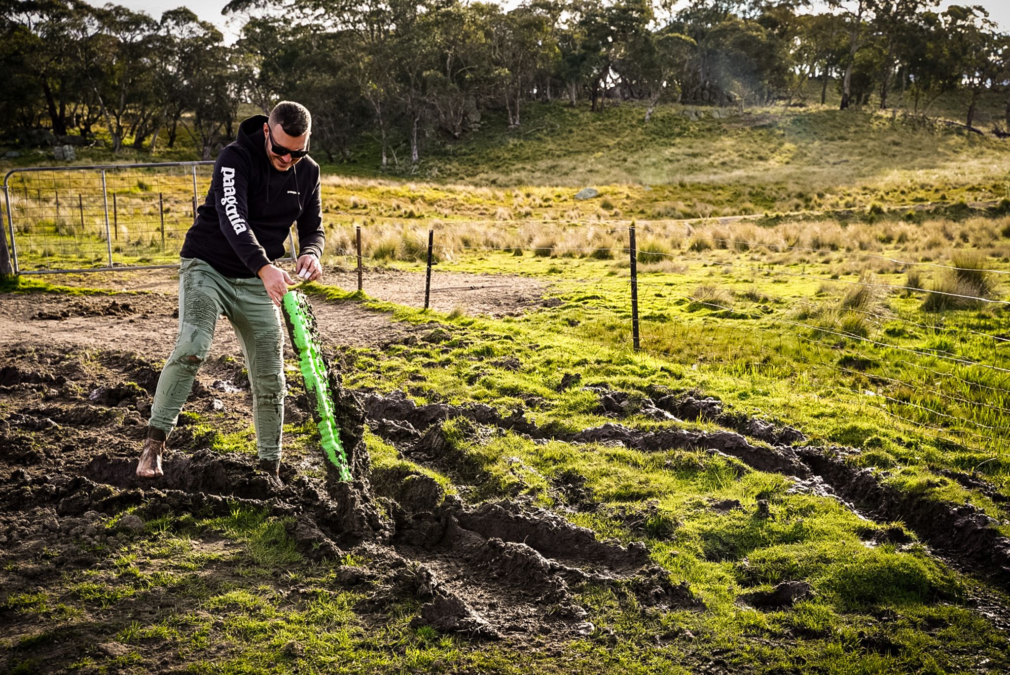 Josh from Adventure Intel Australia digging through mud