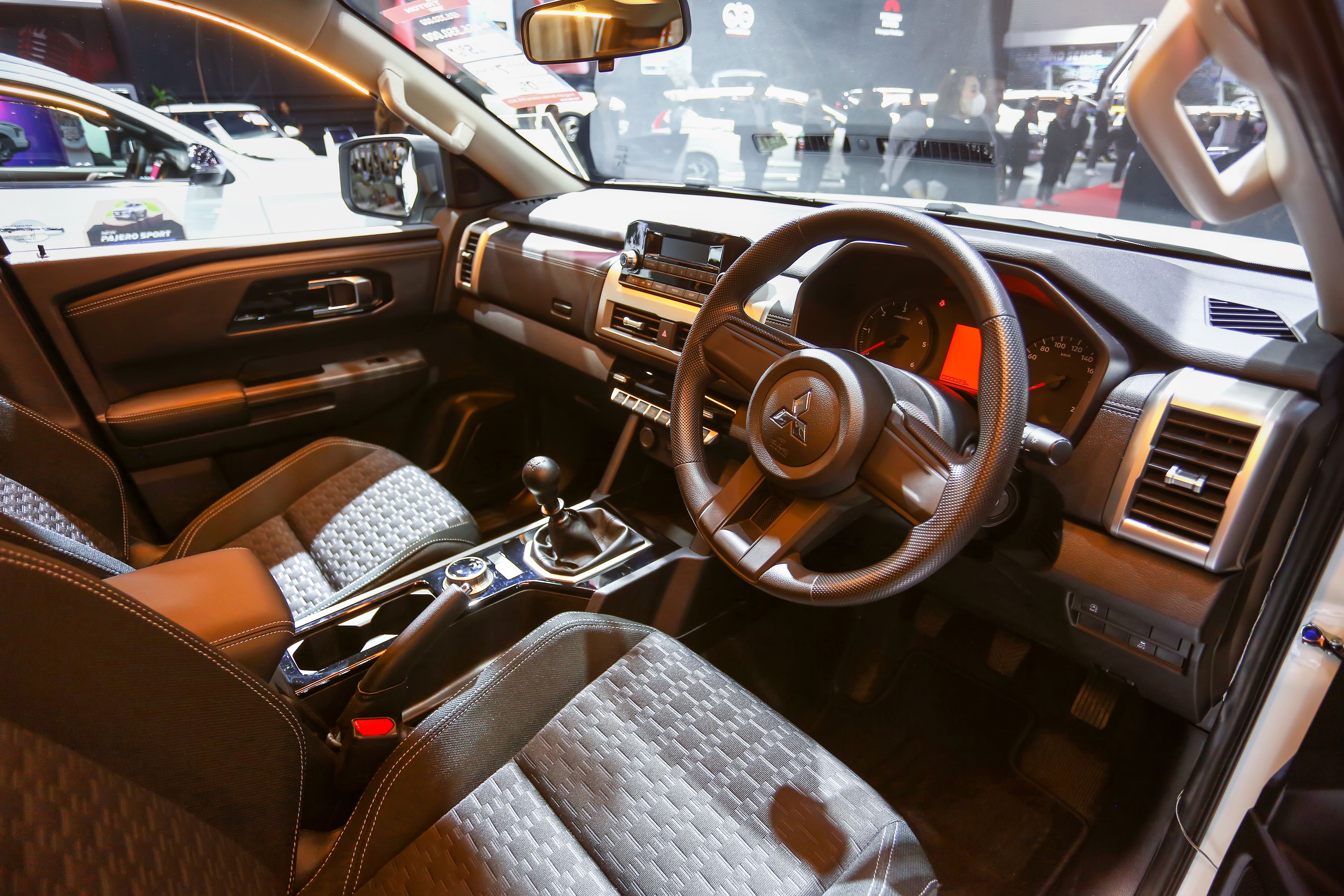 interior of a mitsubishi trito with dark furnishings
