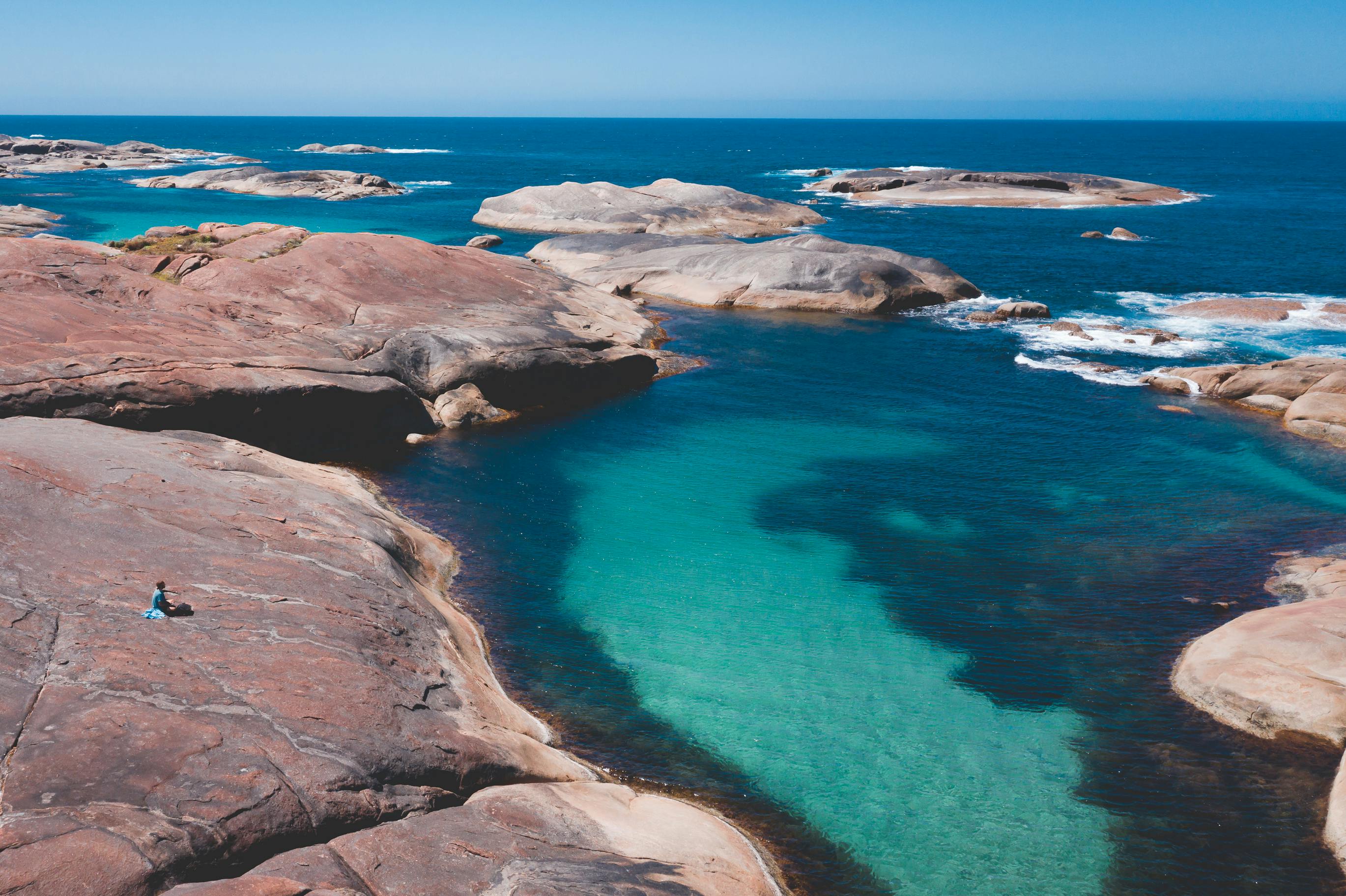 William Bay, WA, Australia. Turquoise water of ocean surrounded with rough formations with person