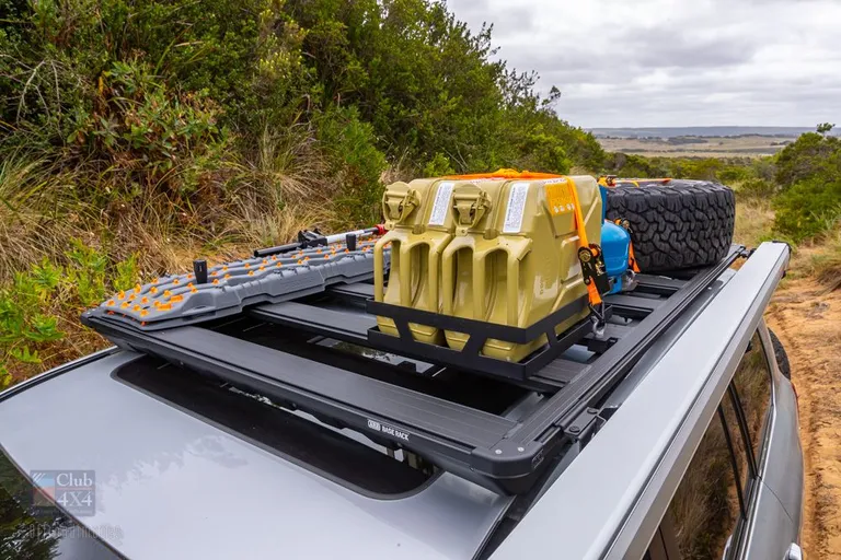 landcruiser with roof rack spare tyre jerry can max trax