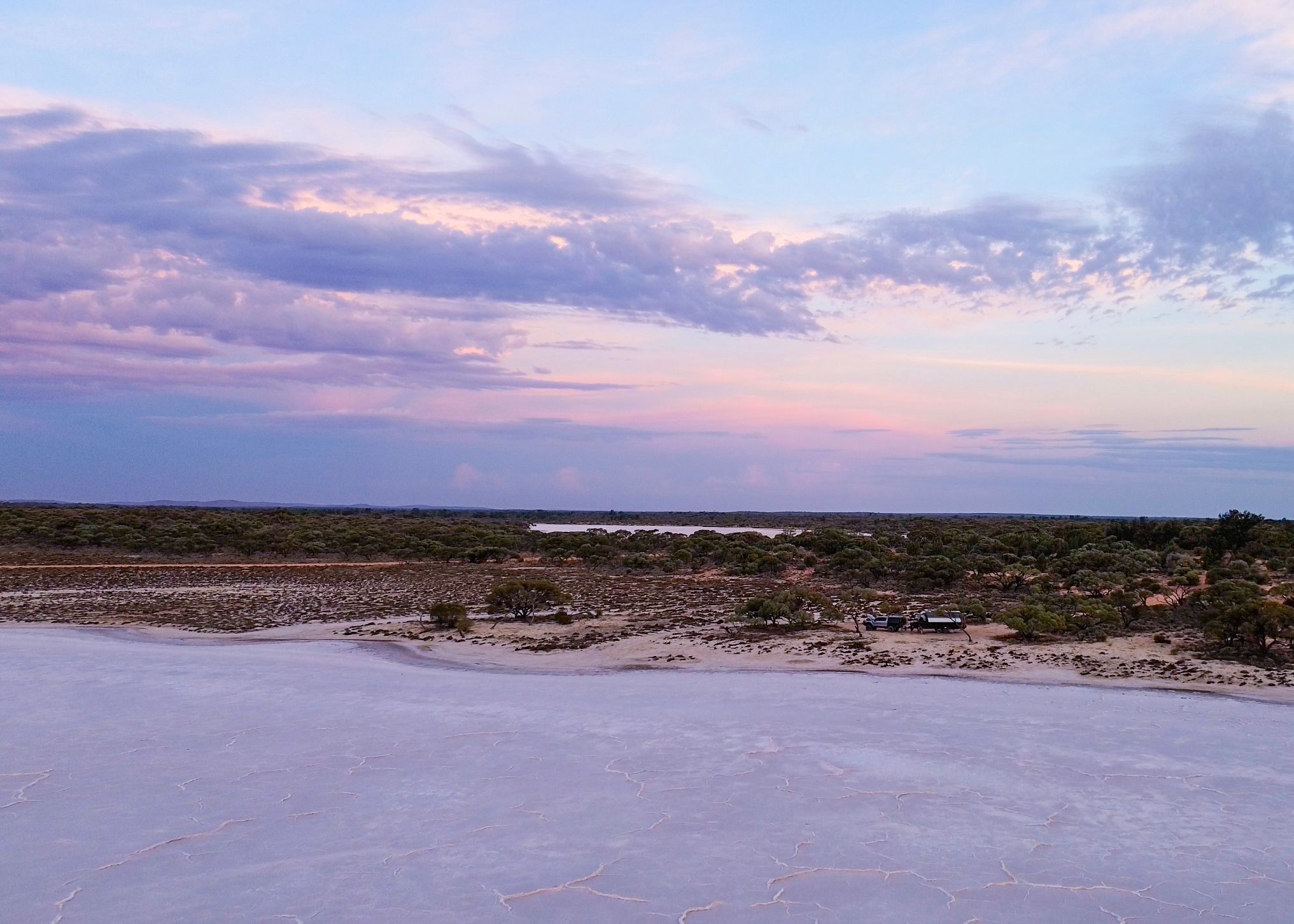 caravan camped at a salt flat