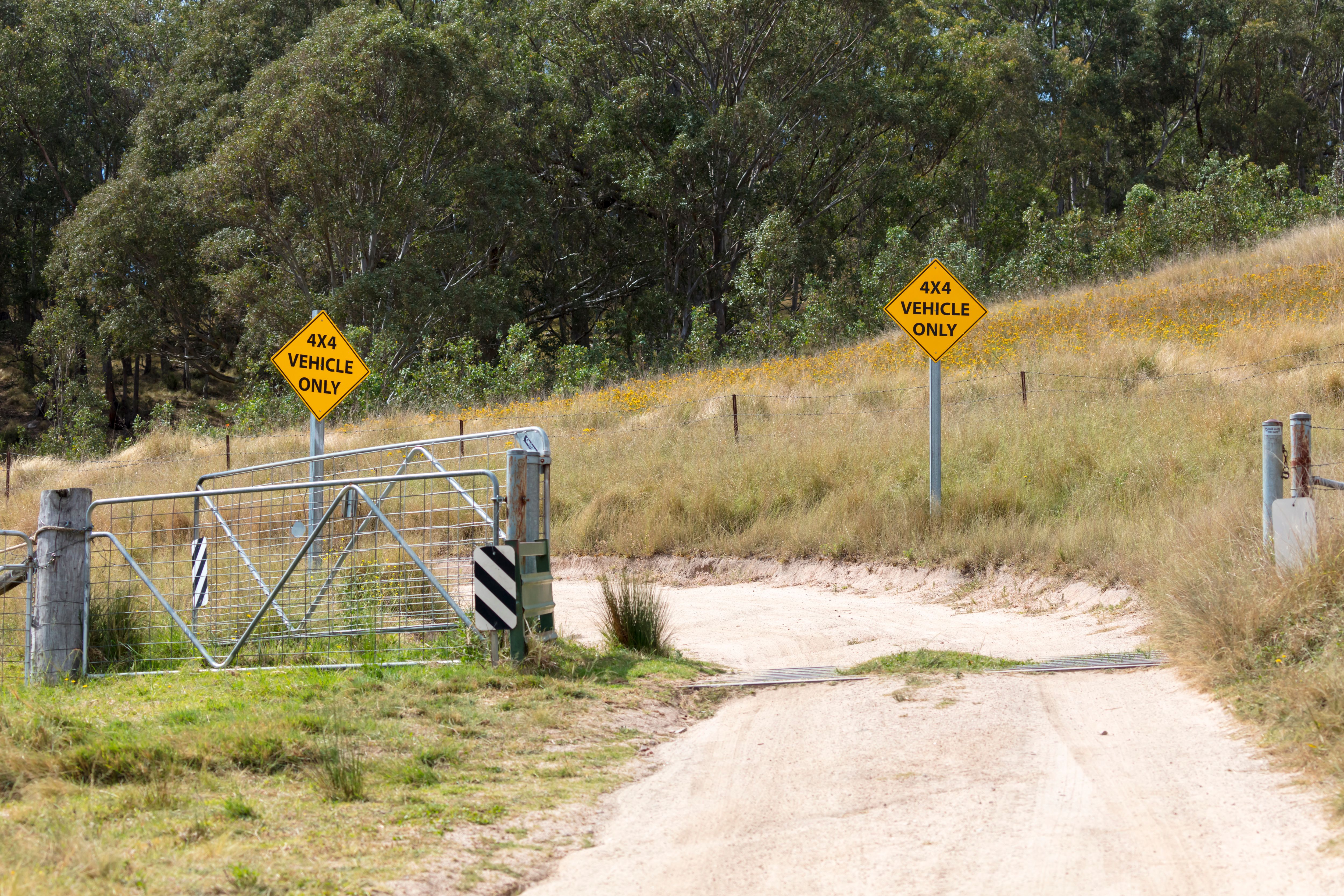 4x4 vehicle only signs behind a gate