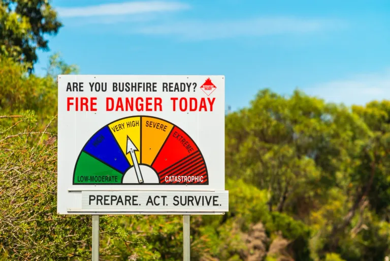 a bushfire warning sign with multiple indicators of bushfire threat