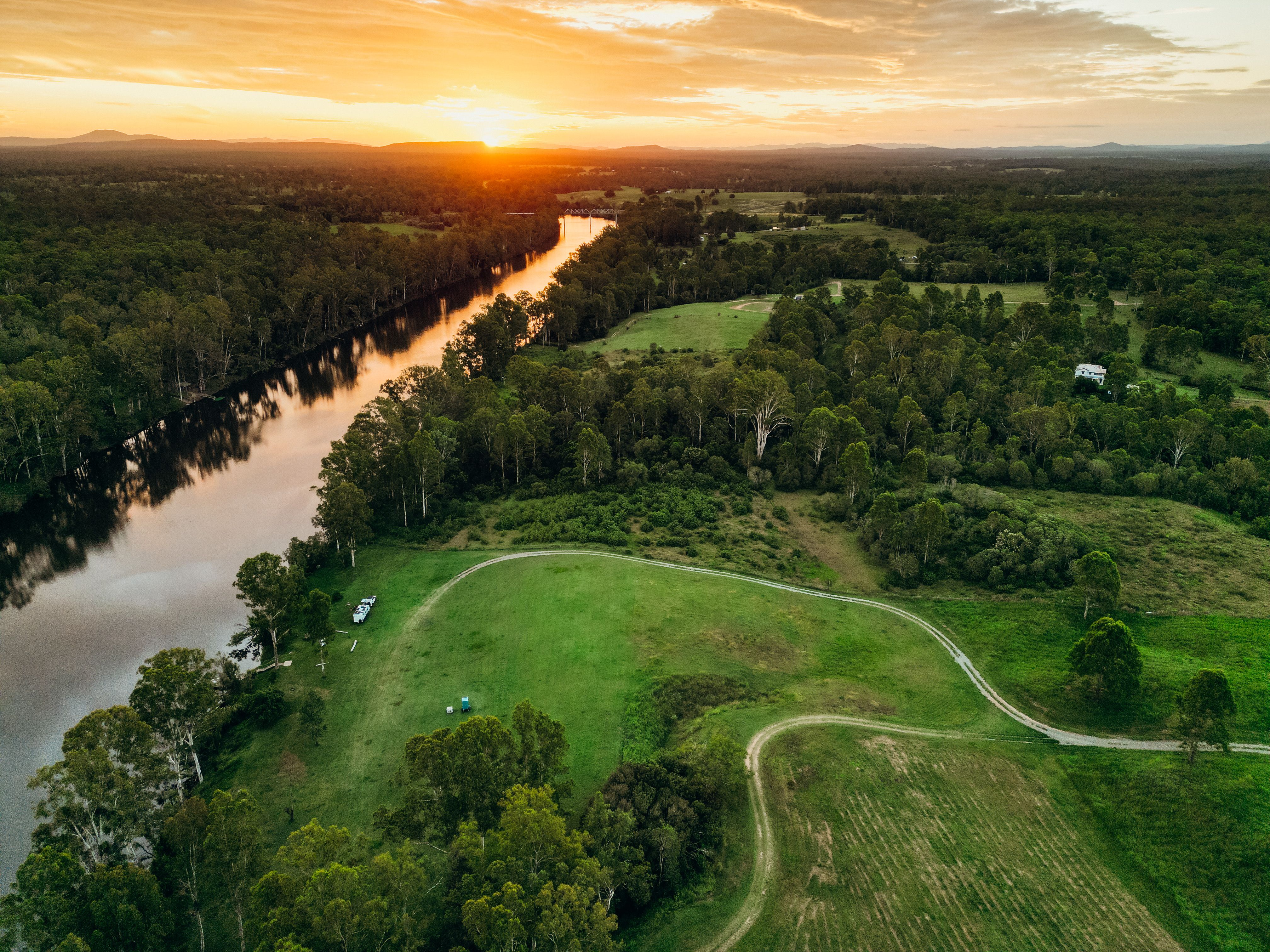 aerial view of campsite by a river